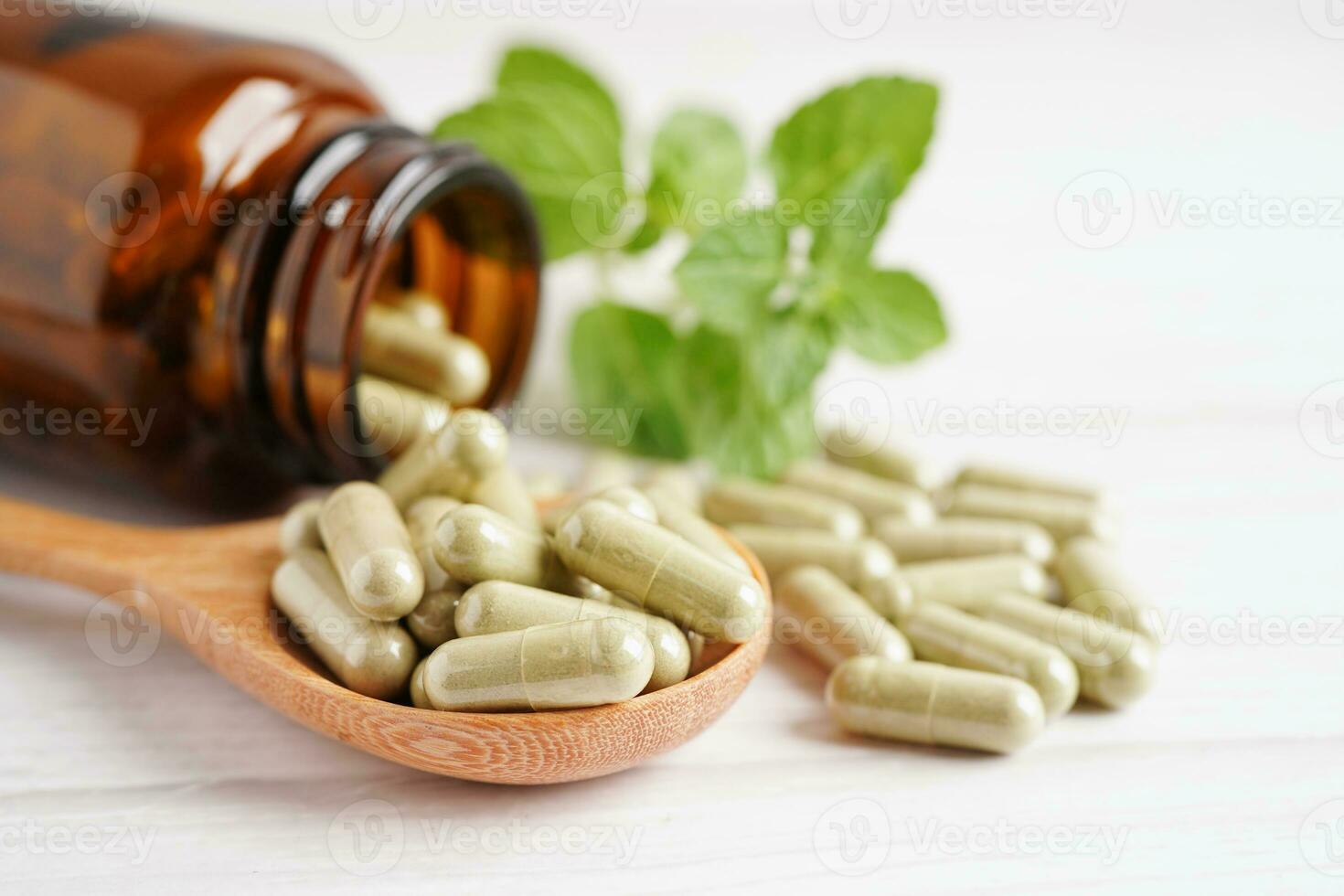 Alternative medicine herbal organic capsule with vitamin E omega 3 fish oil, mineral, drug with herbs leaf natural supplements for healthy good life. photo