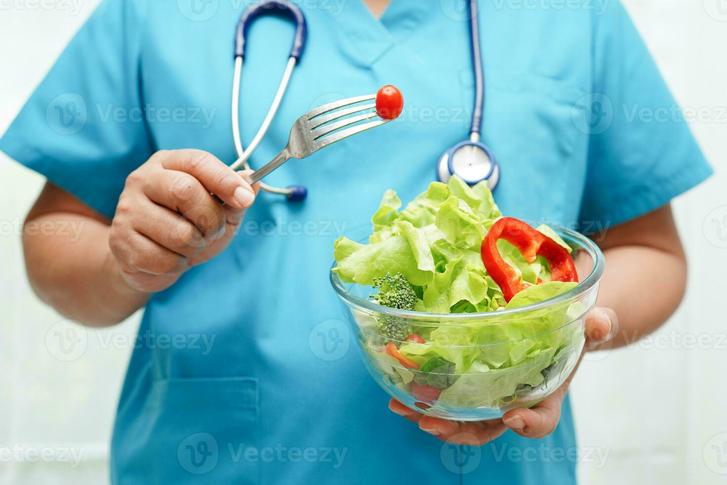 Asian Nutritionist holding healthy food for patient in hospital, nutrition and vitamin. photo