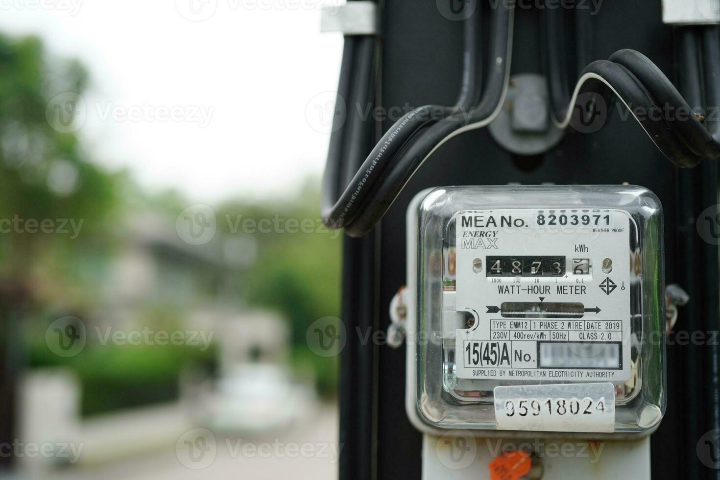 Electric measuring power meter for energy cost at home and office. photo