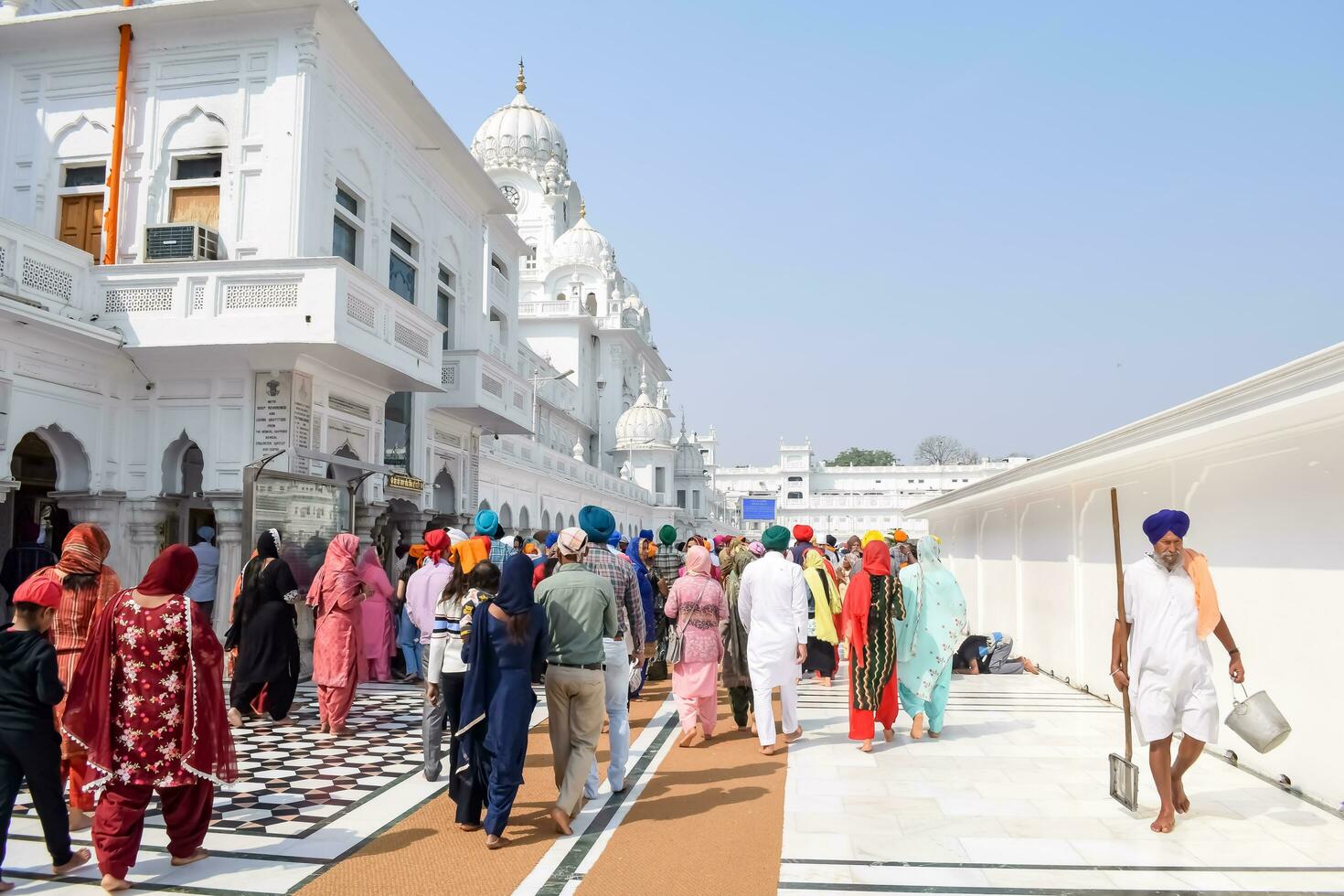 Amritsar, India - February 26 2023 - Unidentified devotees from various parts at Golden Temple - Harmandir Sahib in Amritsar, Punjab, India, Famous indian sikh landmark, Golden Temple photo
