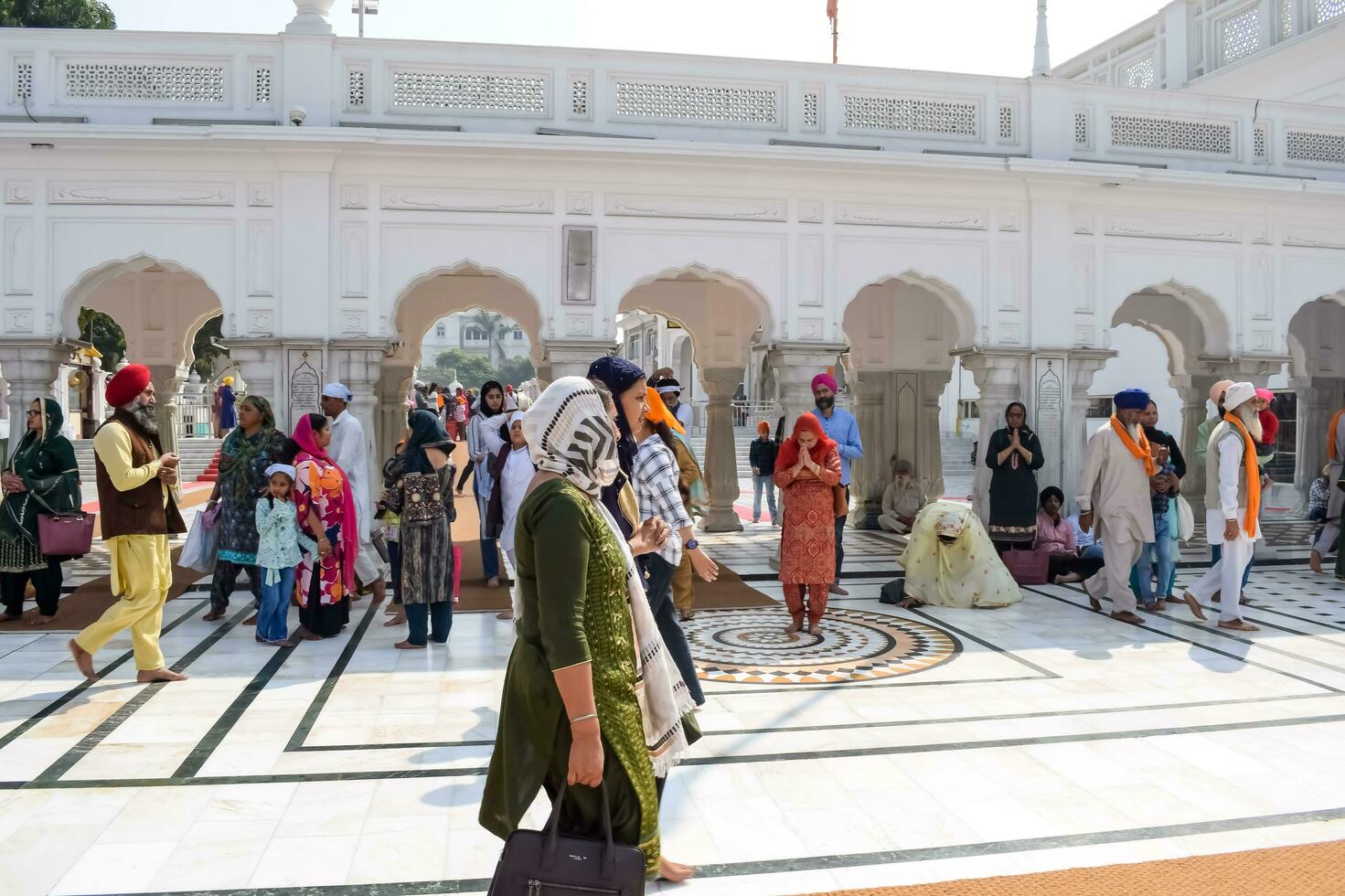 Amritsar, India - February 26 2023 - Unidentified devotees from various parts at Golden Temple - Harmandir Sahib in Amritsar, Punjab, India, Famous indian sikh landmark, Golden Temple photo
