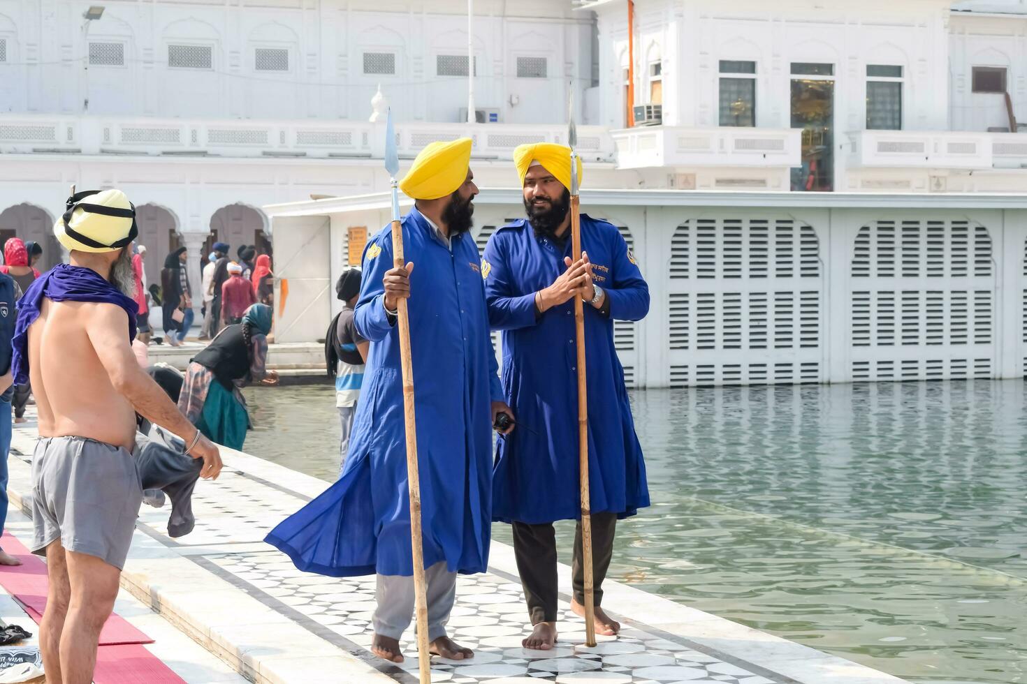 Amritsar, India - February 26 2023 - Unidentified devotees from various parts at Golden Temple - Harmandir Sahib in Amritsar, Punjab, India, Famous indian sikh landmark, Golden Temple photo