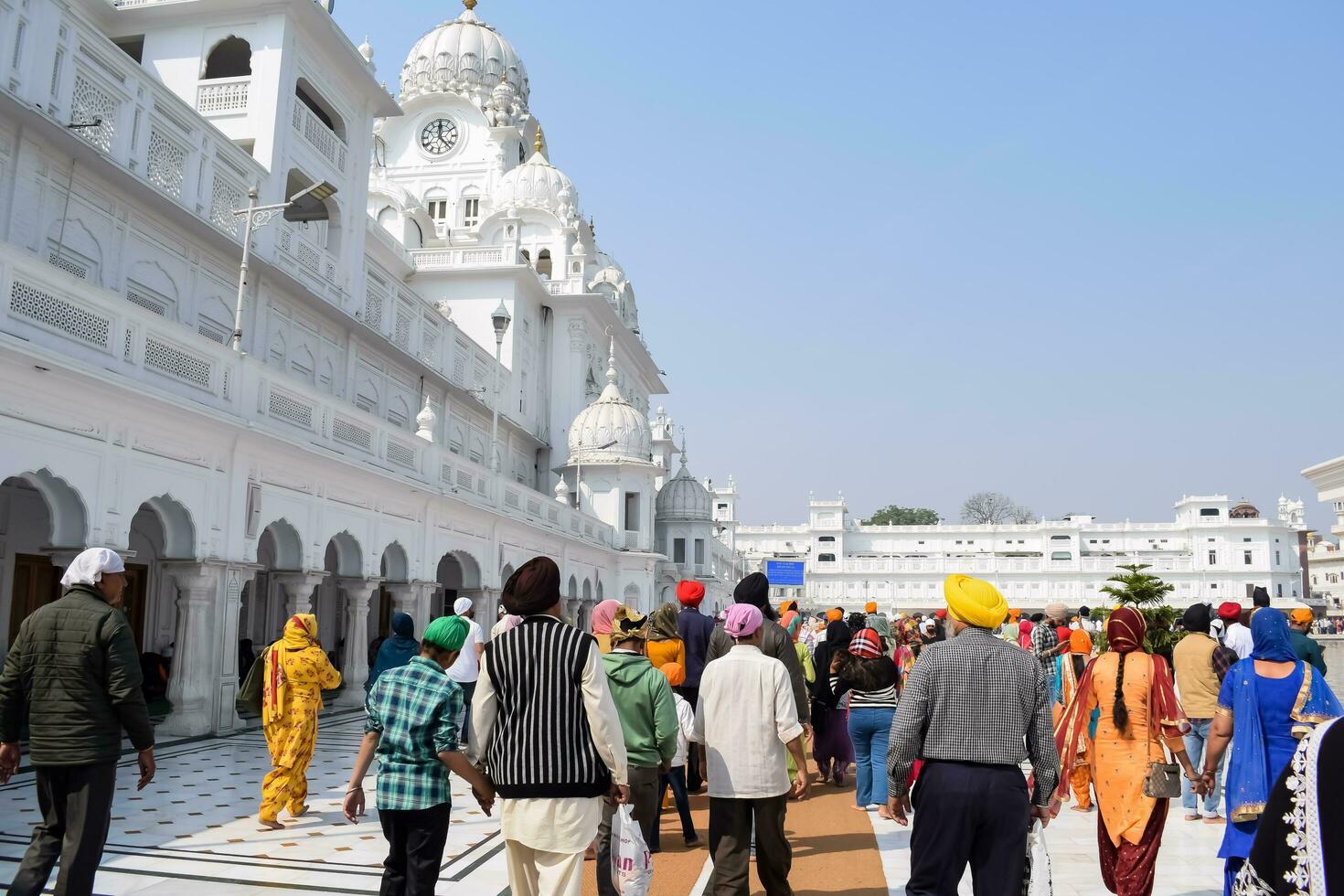 Amritsar, India - February 26 2023 - Unidentified devotees from various parts at Golden Temple - Harmandir Sahib in Amritsar, Punjab, India, Famous indian sikh landmark, Golden Temple photo