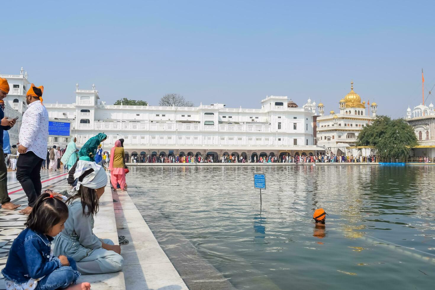 Amritsar, India - February 26 2023 - Unidentified devotees from various parts at Golden Temple - Harmandir Sahib in Amritsar, Punjab, India, Famous indian sikh landmark, Golden Temple photo