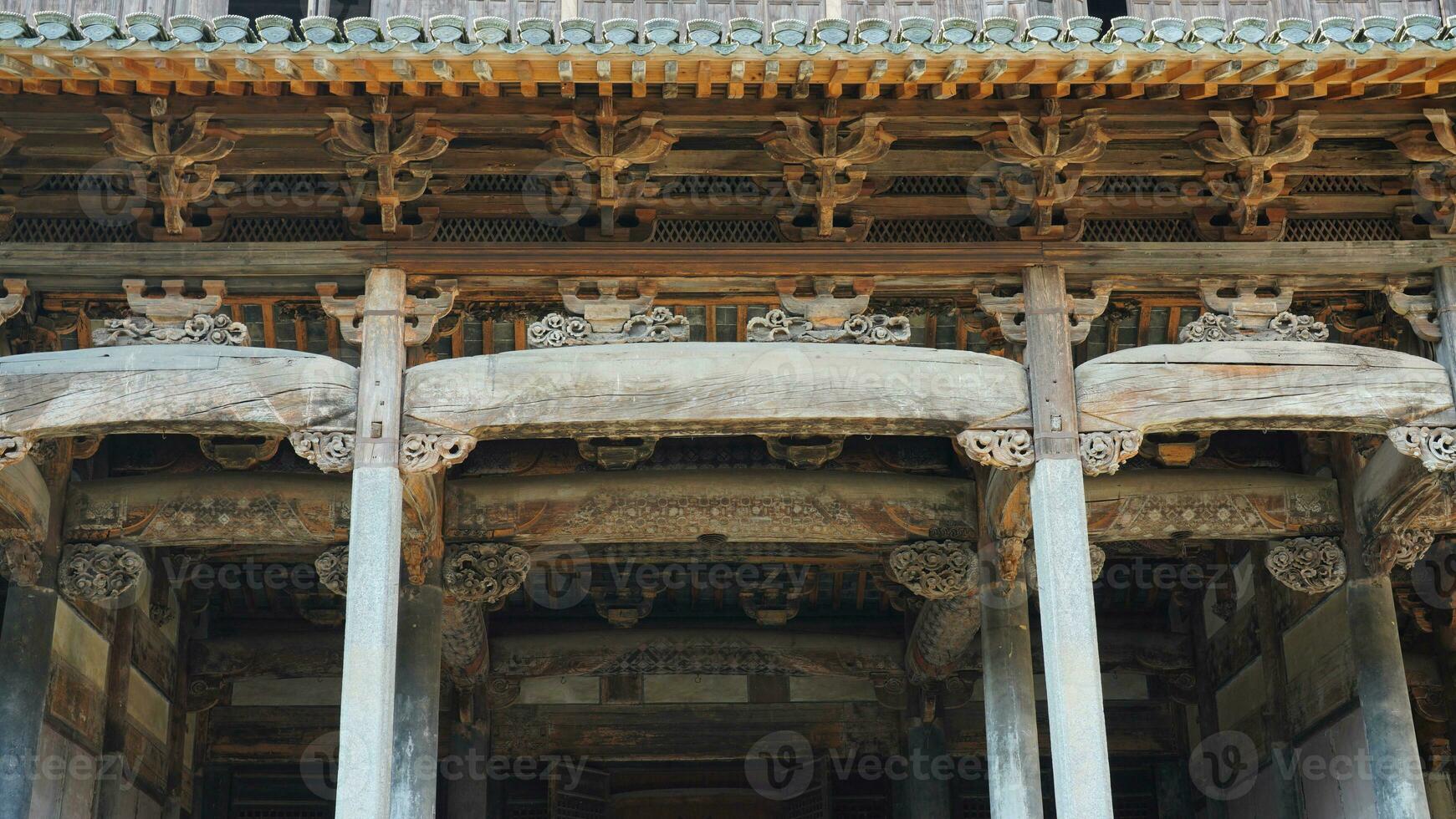 The old wooden Chinese house carved with the beautiful sculpture in the countryside village of the China photo