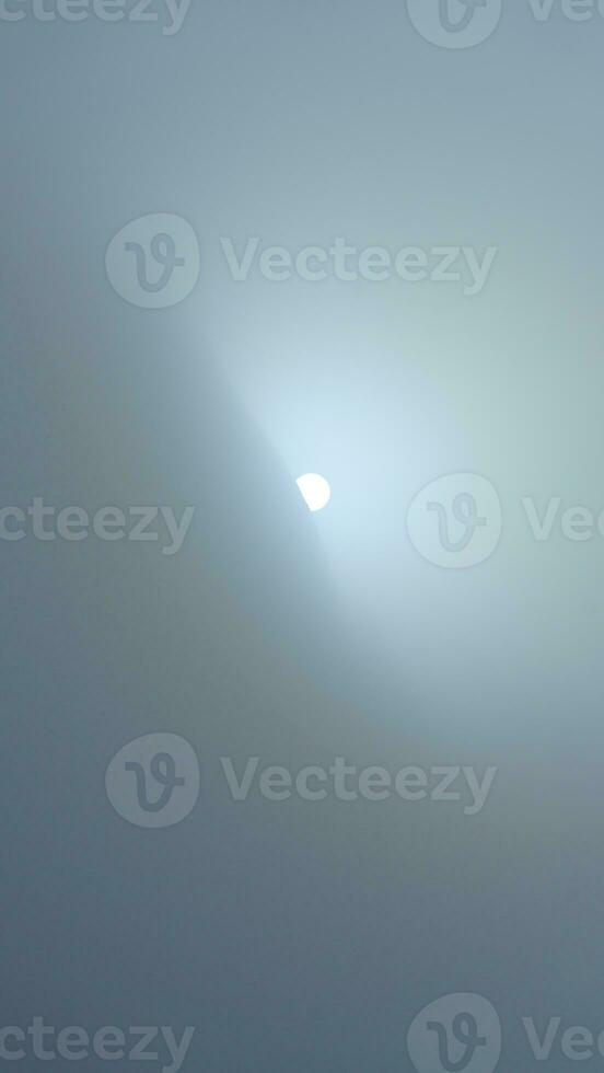 The beautiful mountains view surrounded by the misty fog in winter photo