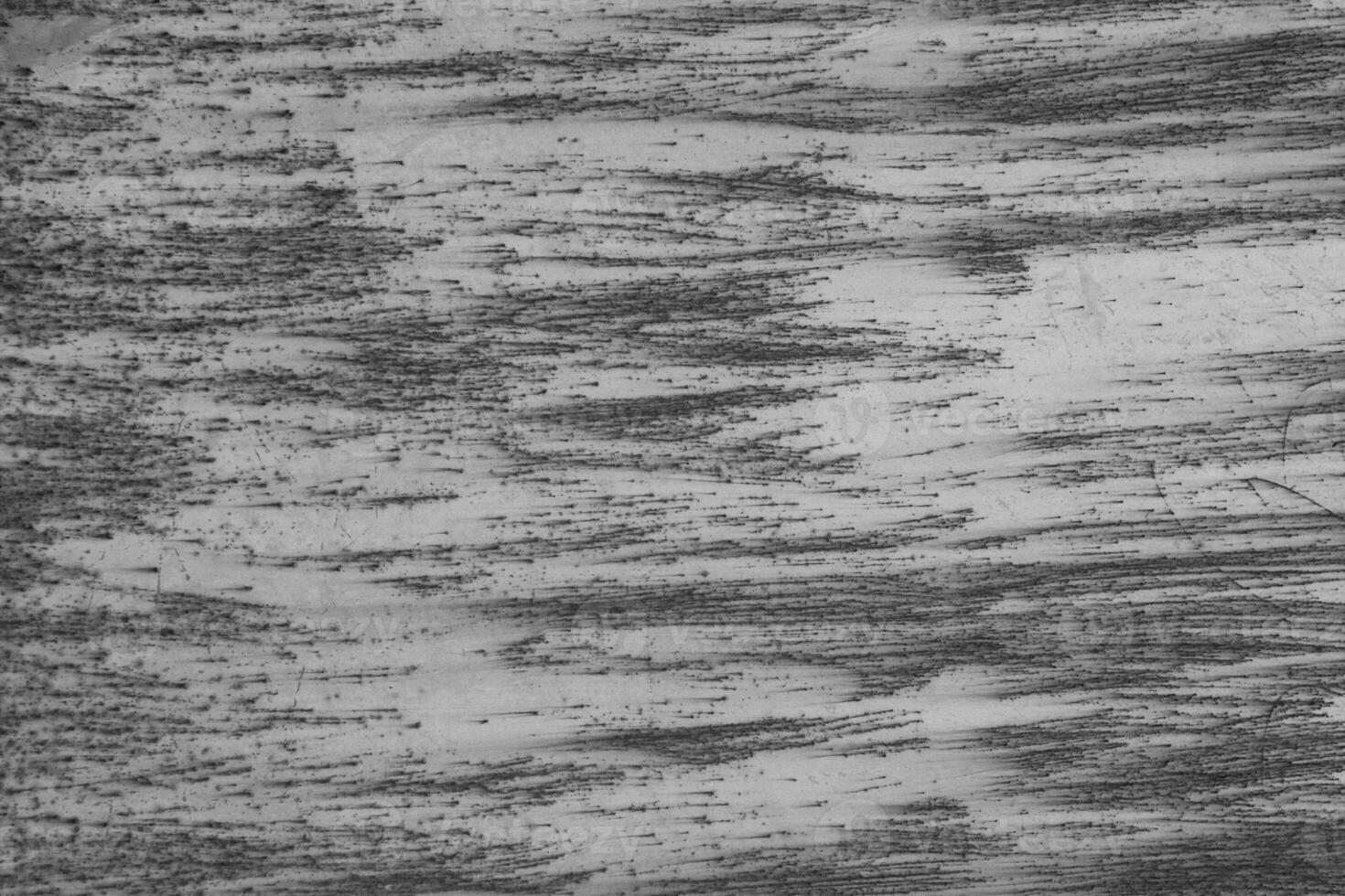 Abstract grunge background. Old rusty metal. Scratches and chips. Glare. Black and white colors. photo