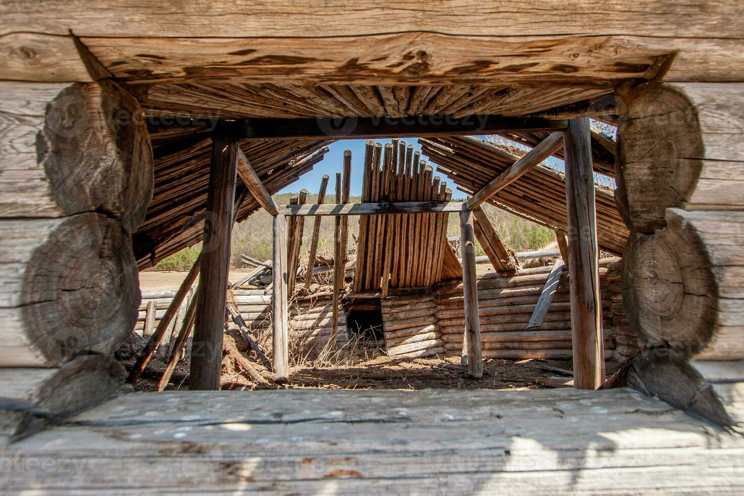 View through the window into the old wooden yurt photo