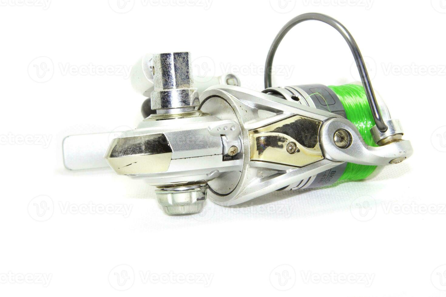 Fishing reels is a leisure sport or hobby of the unemployed, fishing is a popular thing for people to fish to eat and is a sport on a white background. photo