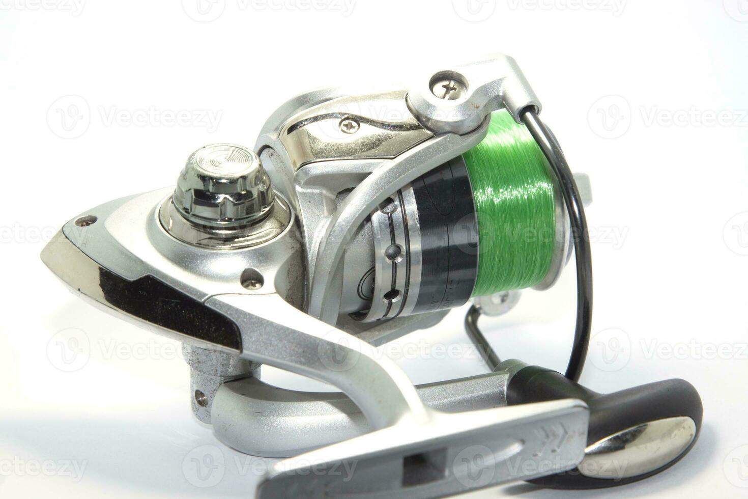 Fishing reels is a leisure sport or hobby of the unemployed, fishing is a popular thing for people to fish to eat and is a sport on a white background. photo