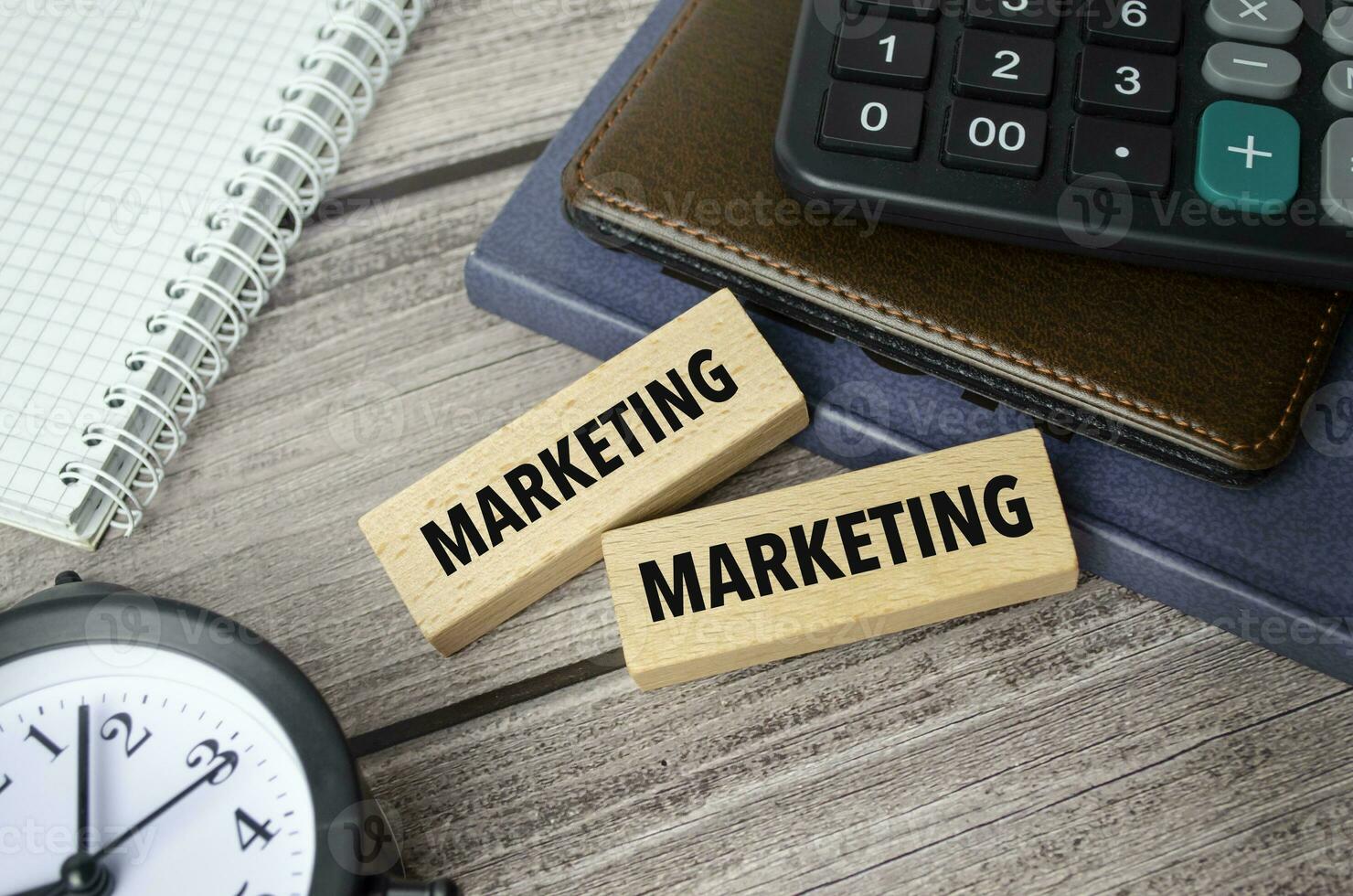 direct marketing . text on wooden blocks on wooden background with office supplies photo