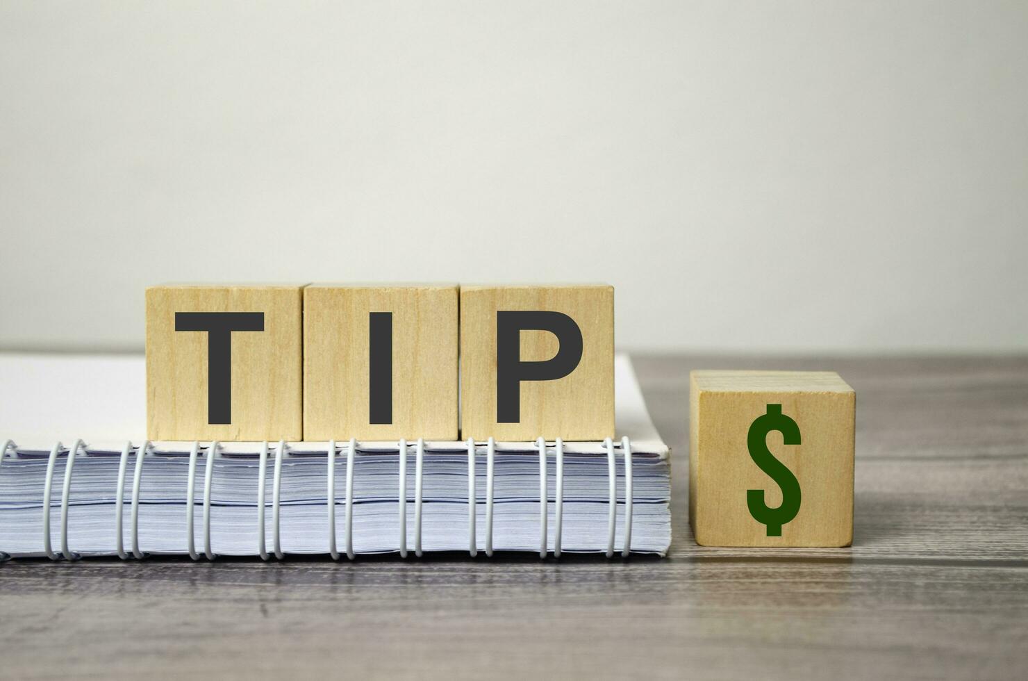 tip word on wooden blocks and wooden background photo