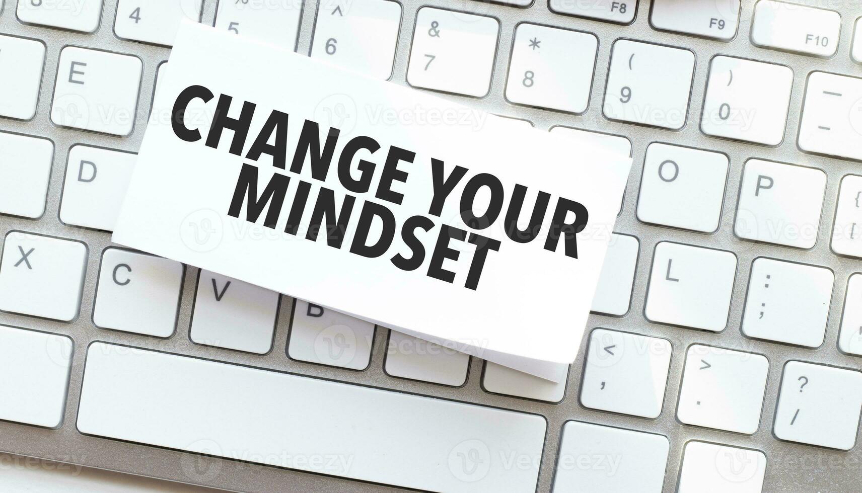 Text change your mindset written on paper sheet on a computer keyboard photo