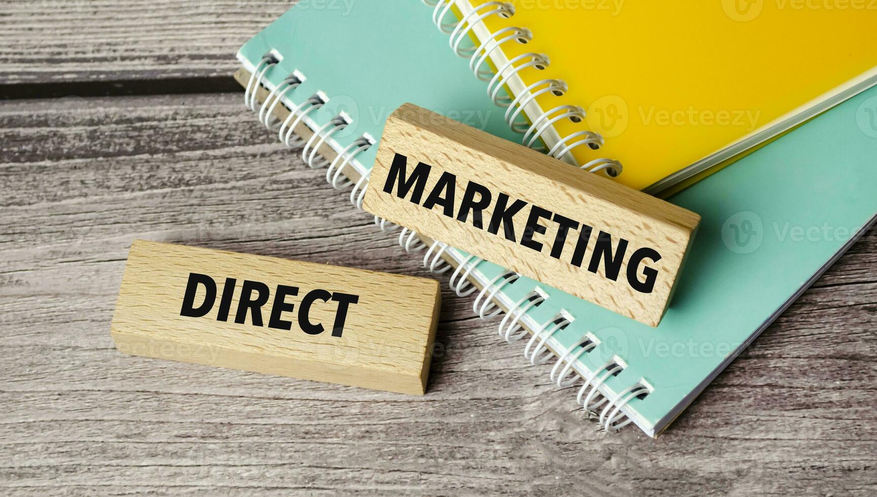 direct marketing symbol. Concept words return on assets on wooden blocks. photo