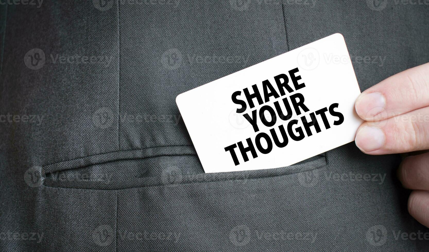 Card with SHARE YOUR THOUGHTS text in pocket of businessman suit. Investment and decisions business concept. photo