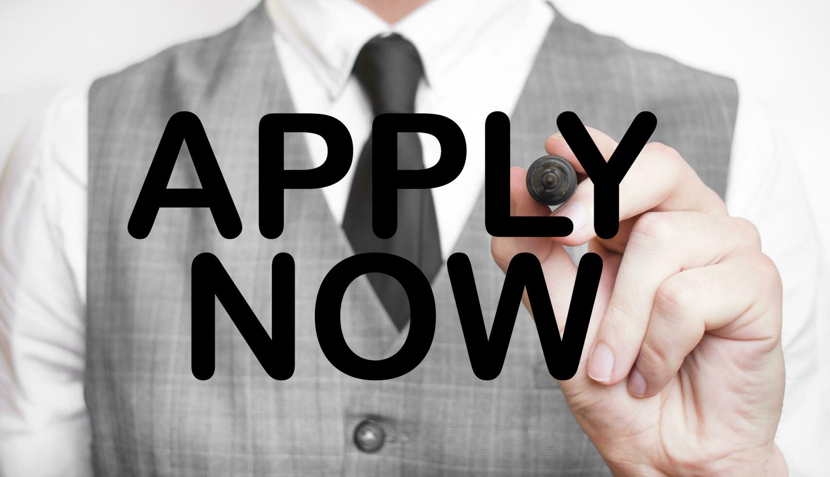 APPLY NOW made with marker and man's hand photo