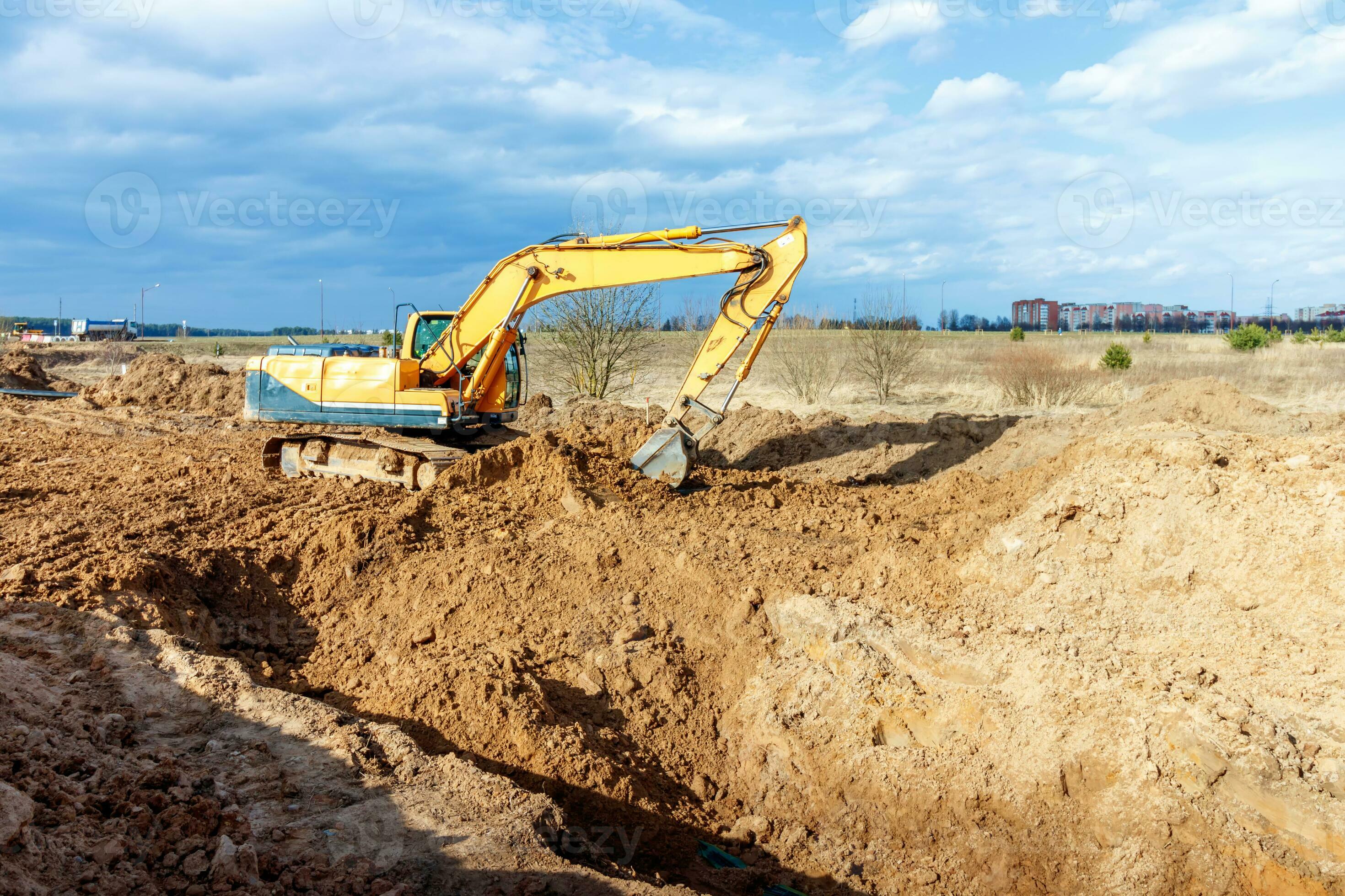 Excavator dig the trenches at a construction site. Trench for laying