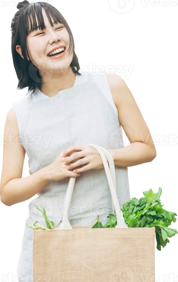 Asian woman hand holding reusable cloth bag with vegetable cutout isolated transparent background png