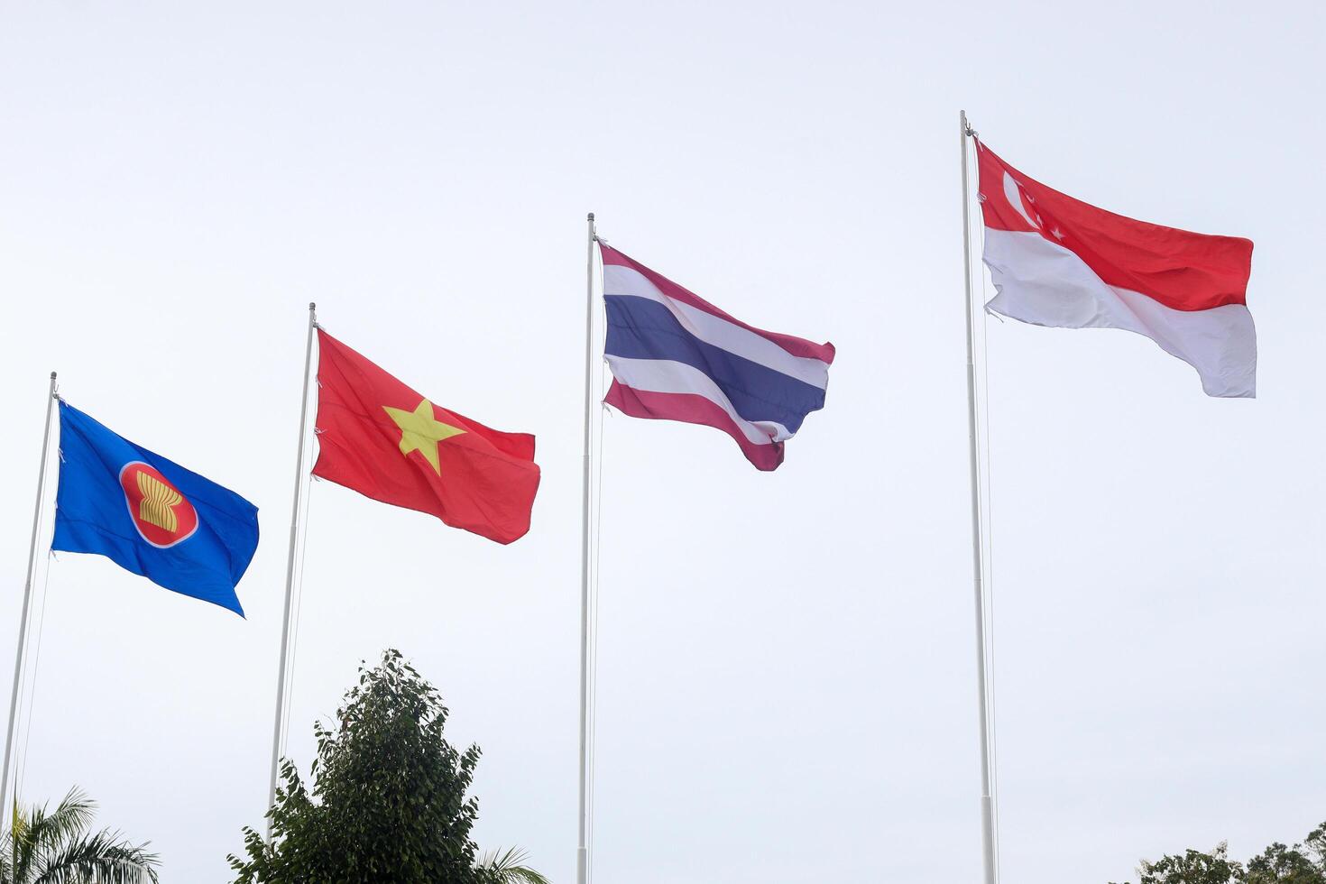 The flags of Association of Southeast Asian Nations the clear blue sky. photo