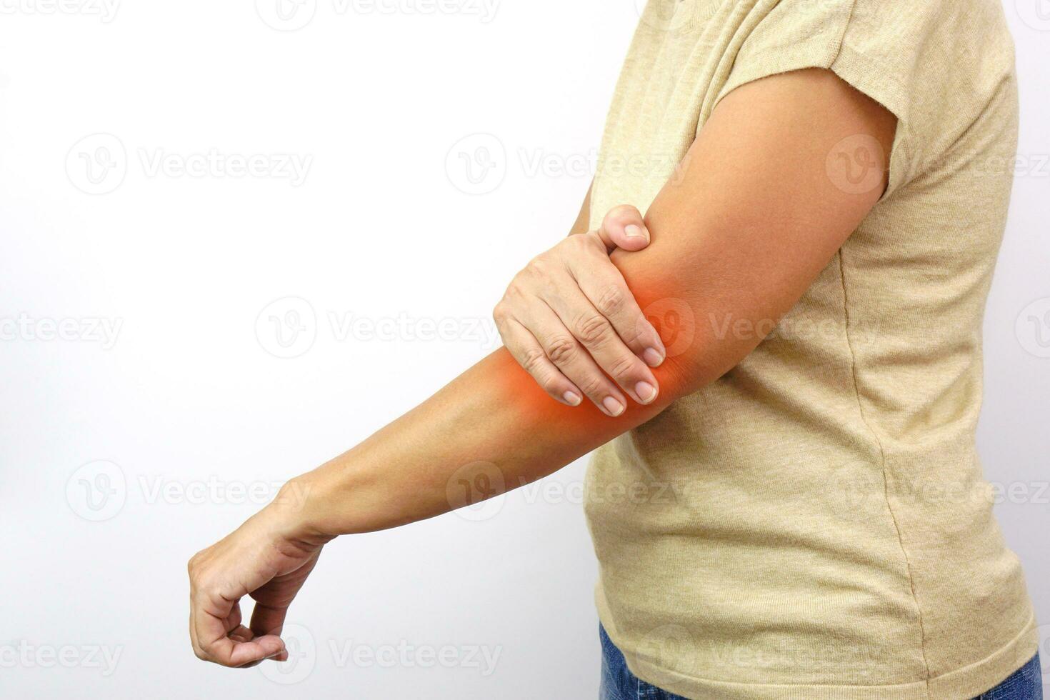 Woman suffering from elbow pain on white background. Healthcare and office syndrome concept. photo