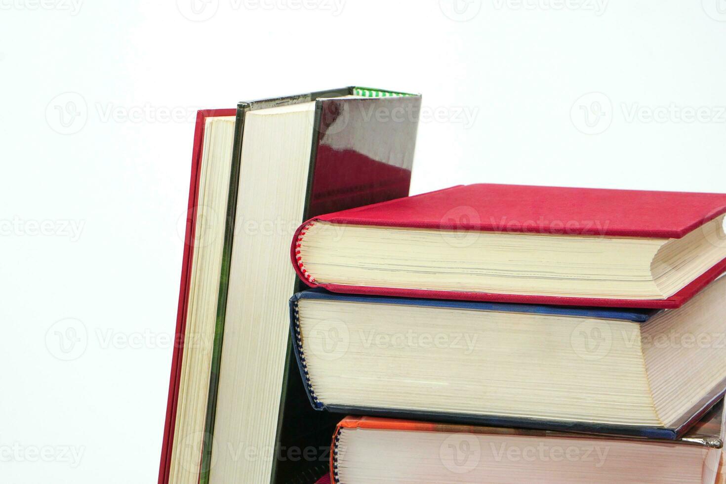 Stack of books on white background. Knowledge and education concept. photo