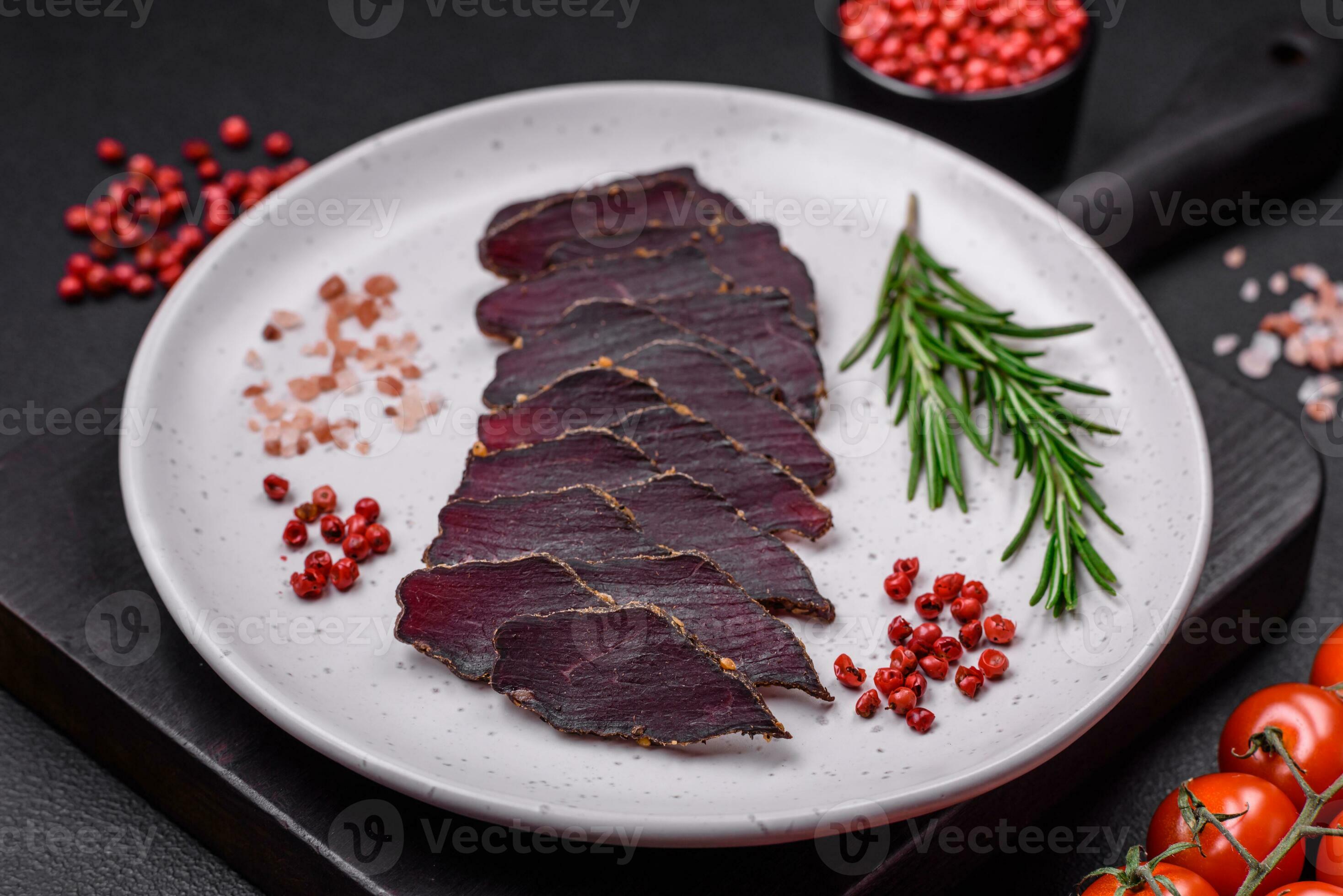 Delicious dried smoked beef or horse meat jerky with spices and salt