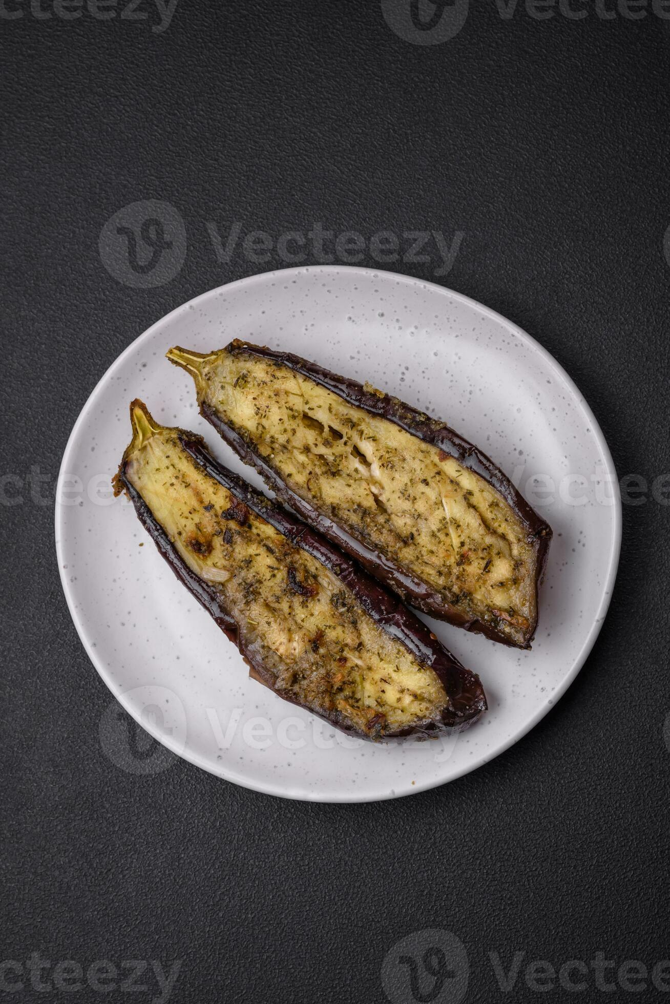Delicious eggplant cut into two halves baked with salt, spices and