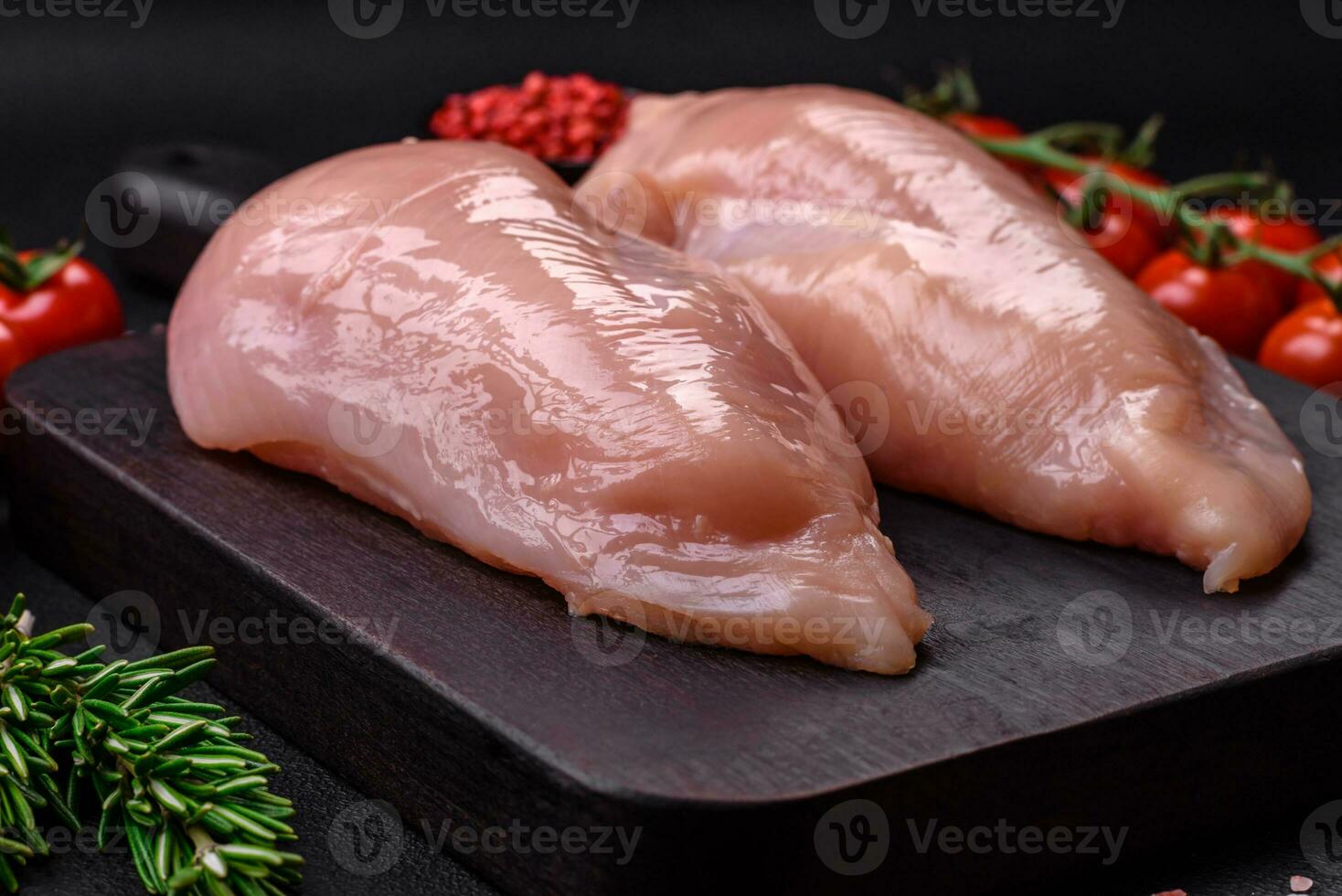 Pieces of raw chicken or turkey fillet with salt, spices and herbs