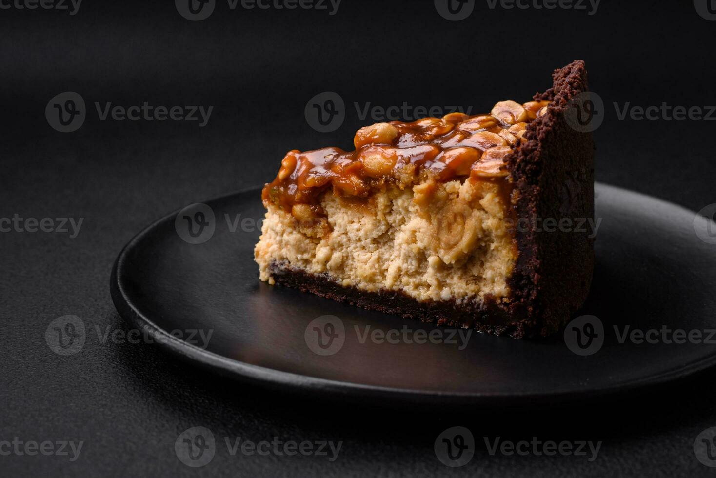 Delicious fresh cheesecake cake or snickers with cream and nuts photo