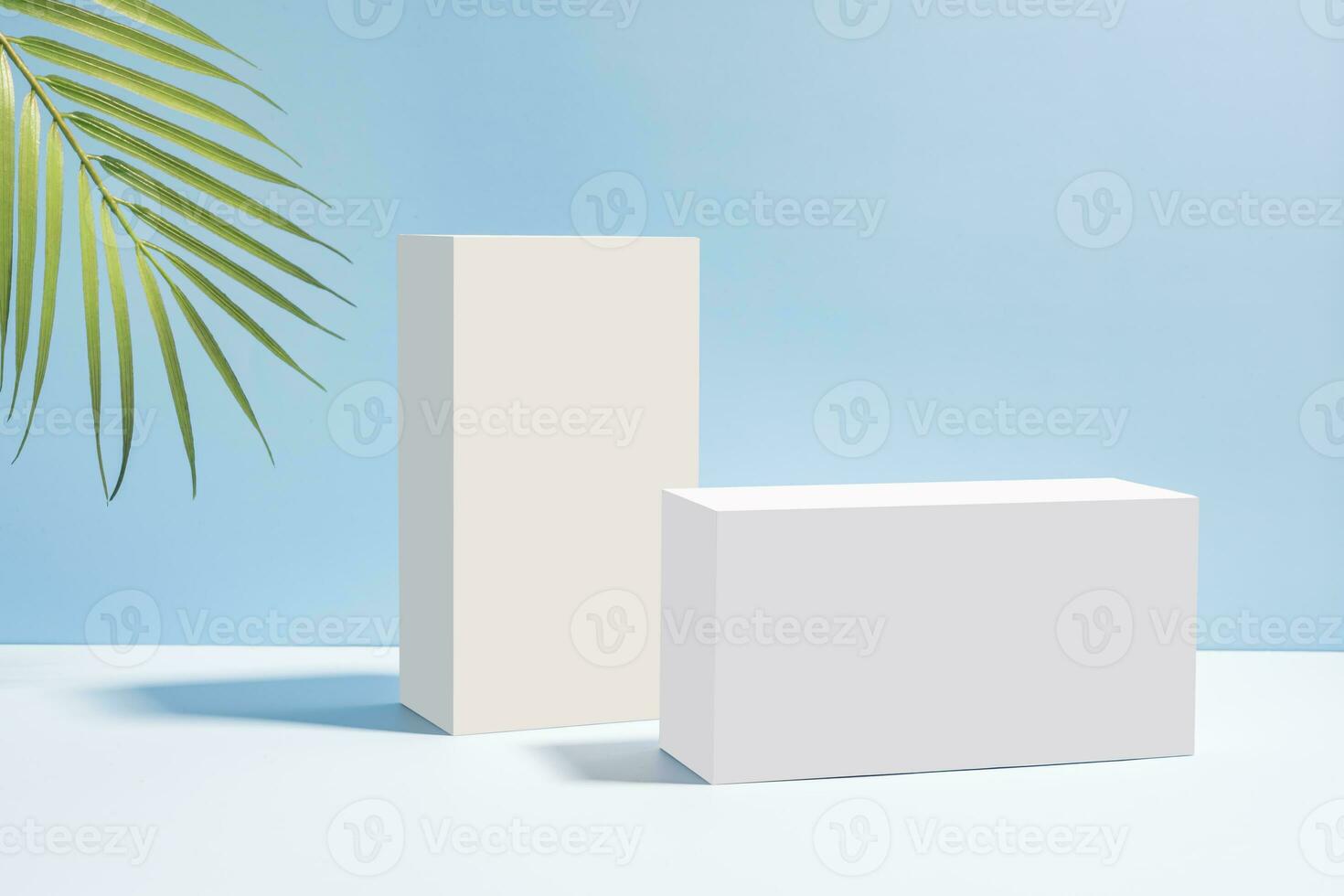 white podiums with palm leaves on blue background. Concept scene stage showcase for product, promotion, sale, banner, presentation of cosmetic products. Minimal showcase empty mock up. photo