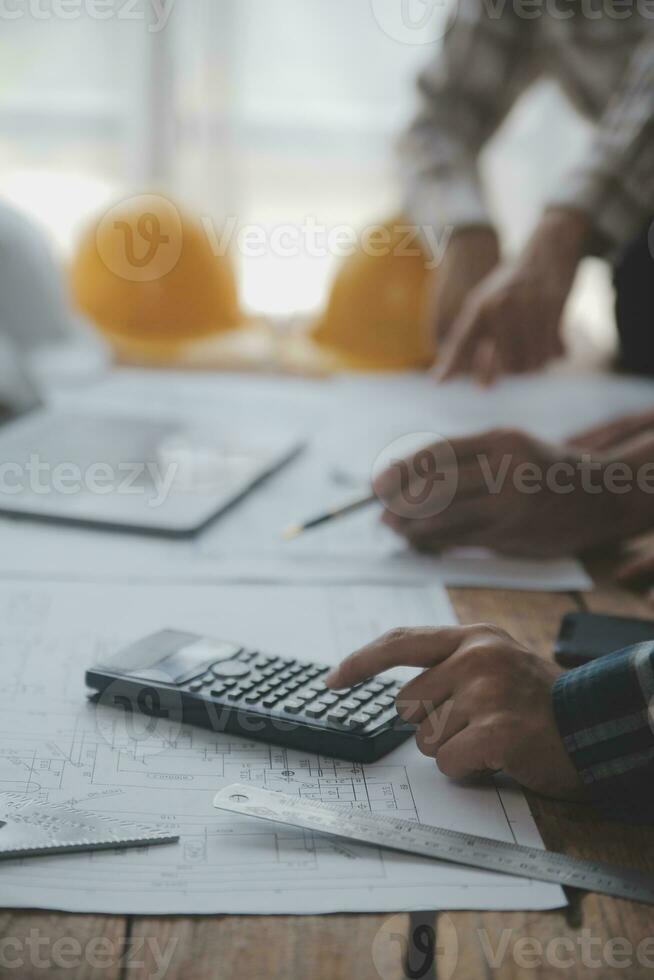 Two business man construction site engineer. Engineering objects on workplace with partners interacting on background photo