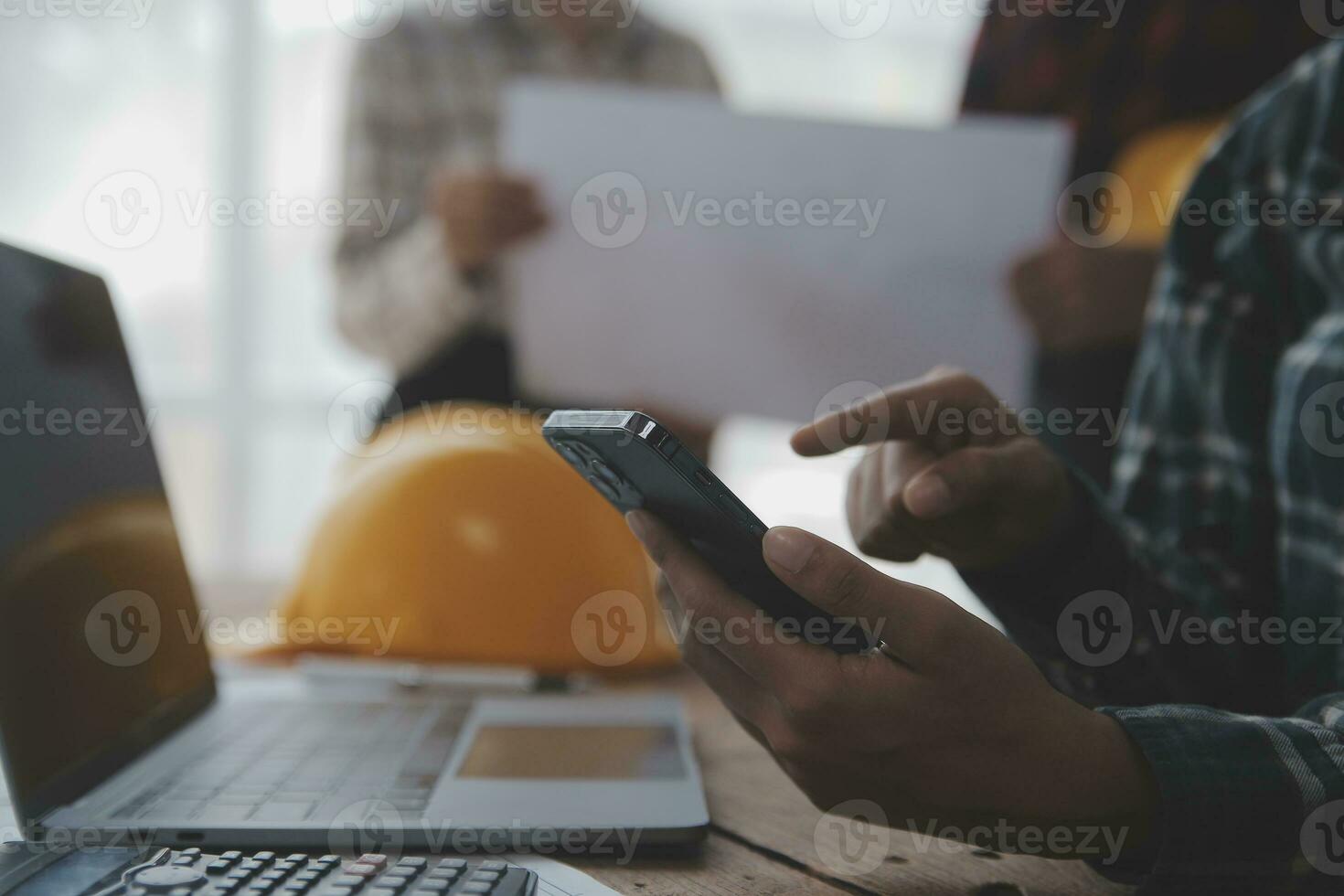 Two business man construction site engineer. Engineering objects on workplace with partners interacting on background photo