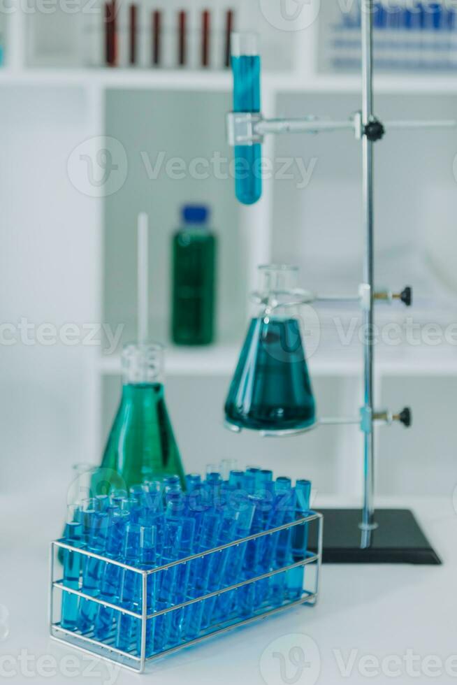 microscope with lab glassware, science laboratory research and development concept photo