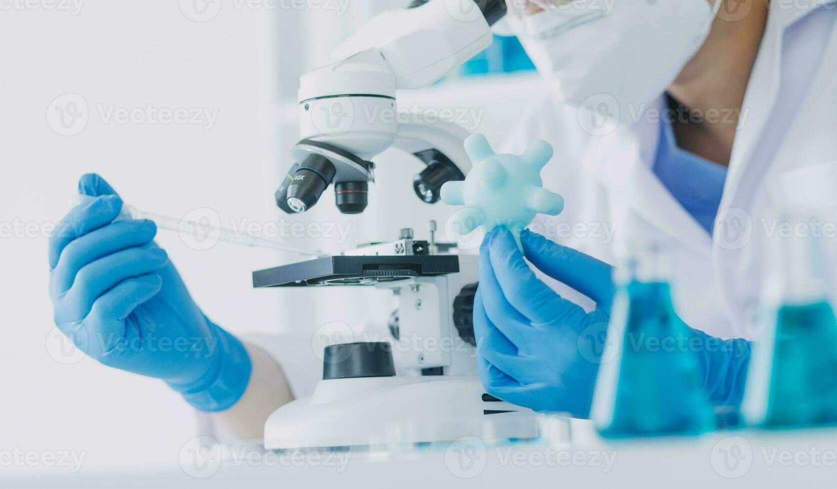 microscope with lab glassware, science laboratory research and development concept photo