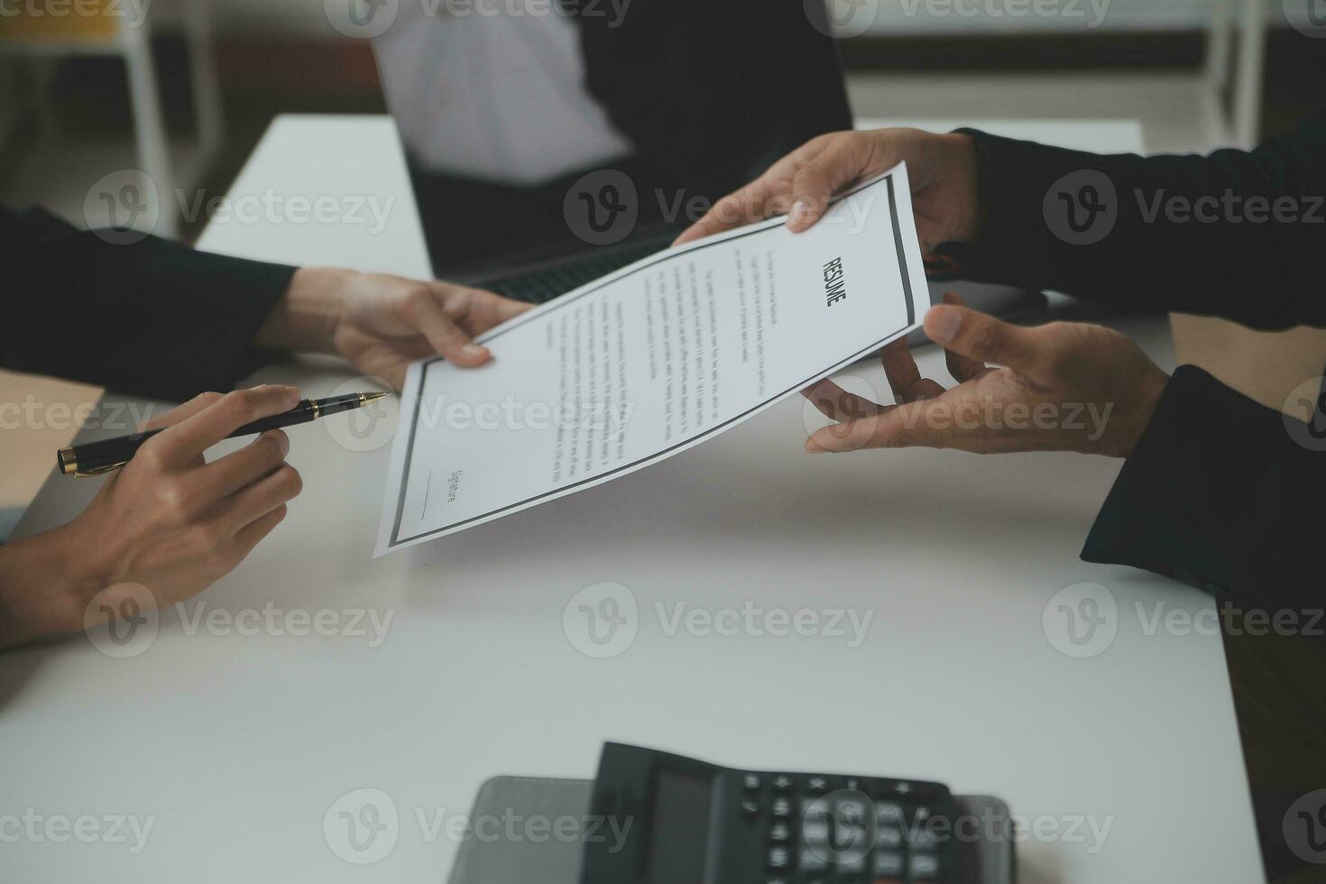 Close up view of job interview in office, focus on resume writing tips, employer reviewing good cv of prepared skilled applicant, recruiter considering application, hr manager making hiring decision photo