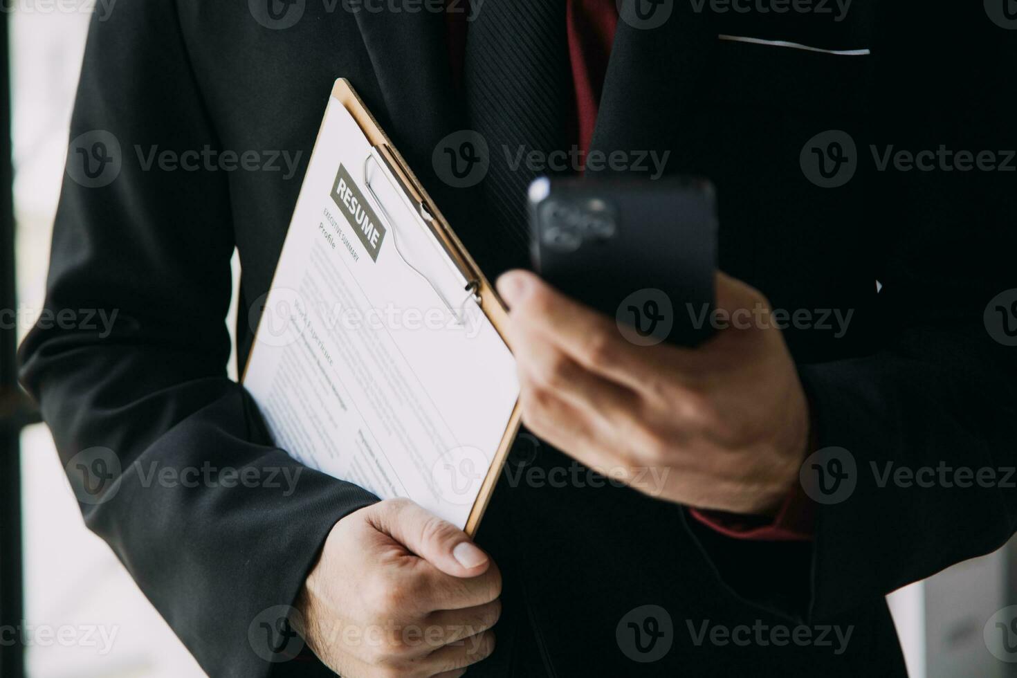 Close up view of job interview in office, focus on resume writing tips, employer reviewing good cv of prepared skilled applicant, recruiter considering application, hr manager making hiring decision photo