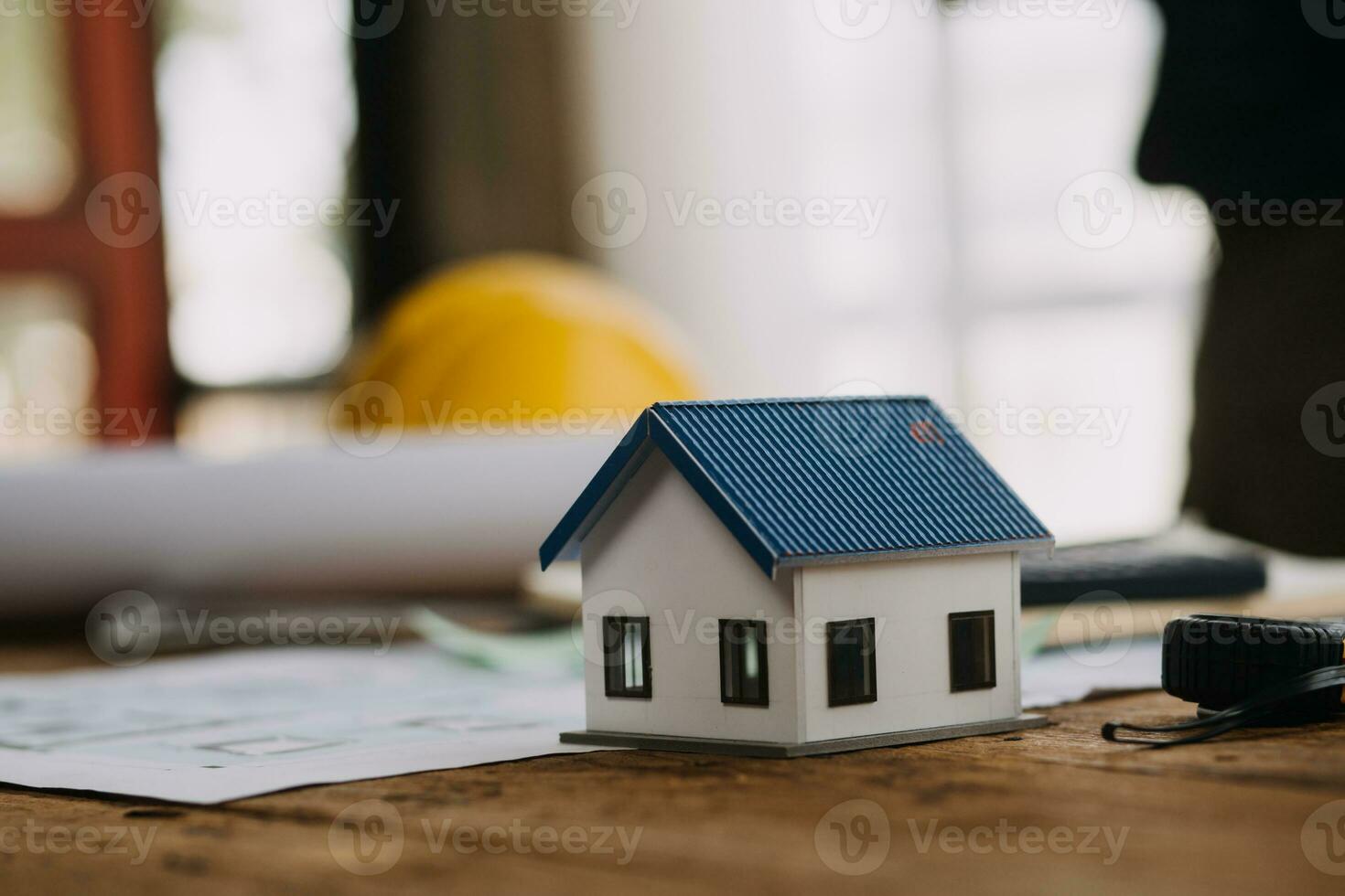 Construction and structure concept of Engineer or architect meeting for project working with partner and engineering tools on model building and blueprint in working site, contract for both companies. photo