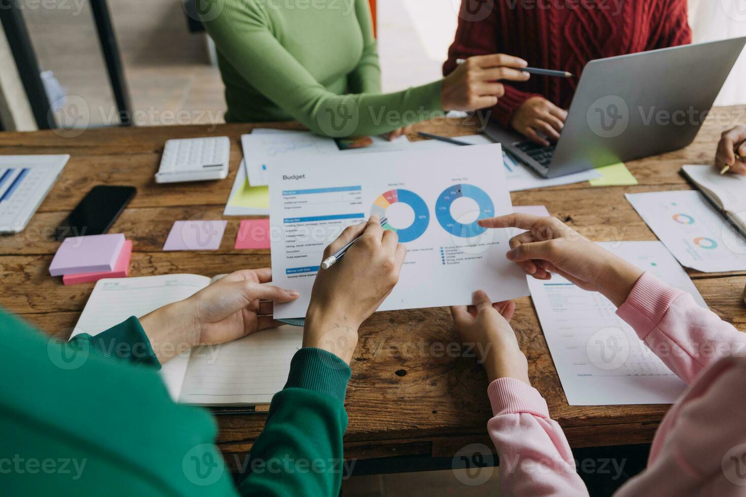 Brainstorming Collaboration and successful partnership analysis by Young business Asian people working in an office workspace photo