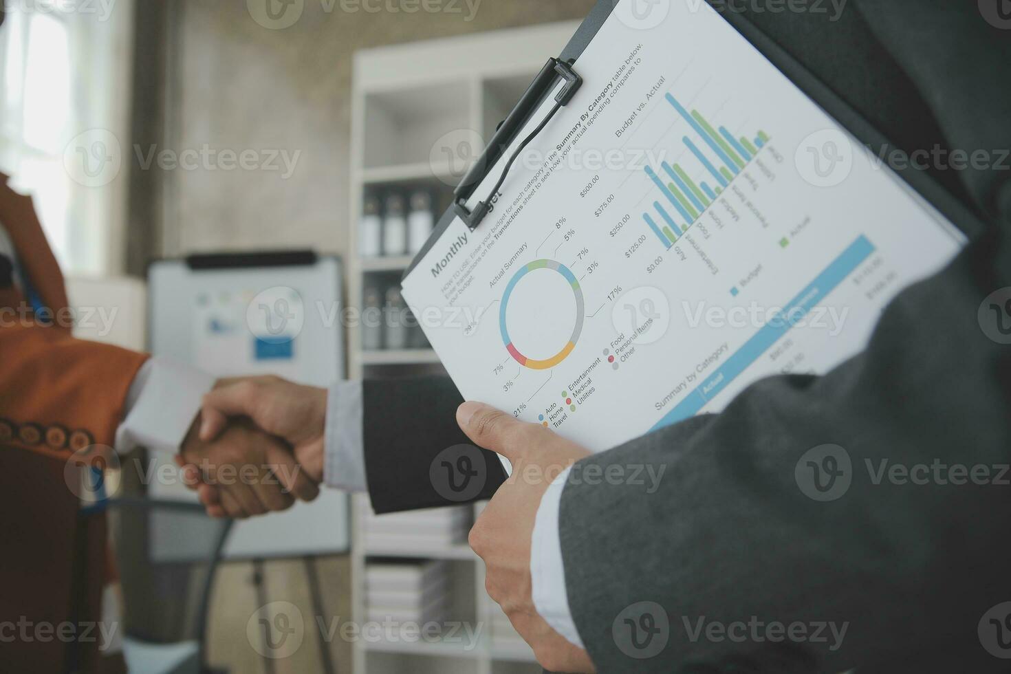 Group of confident business people point to graphs and charts to analyze market data, balance sheet, account, net profit to plan new sales strategies to increase production capacity. photo