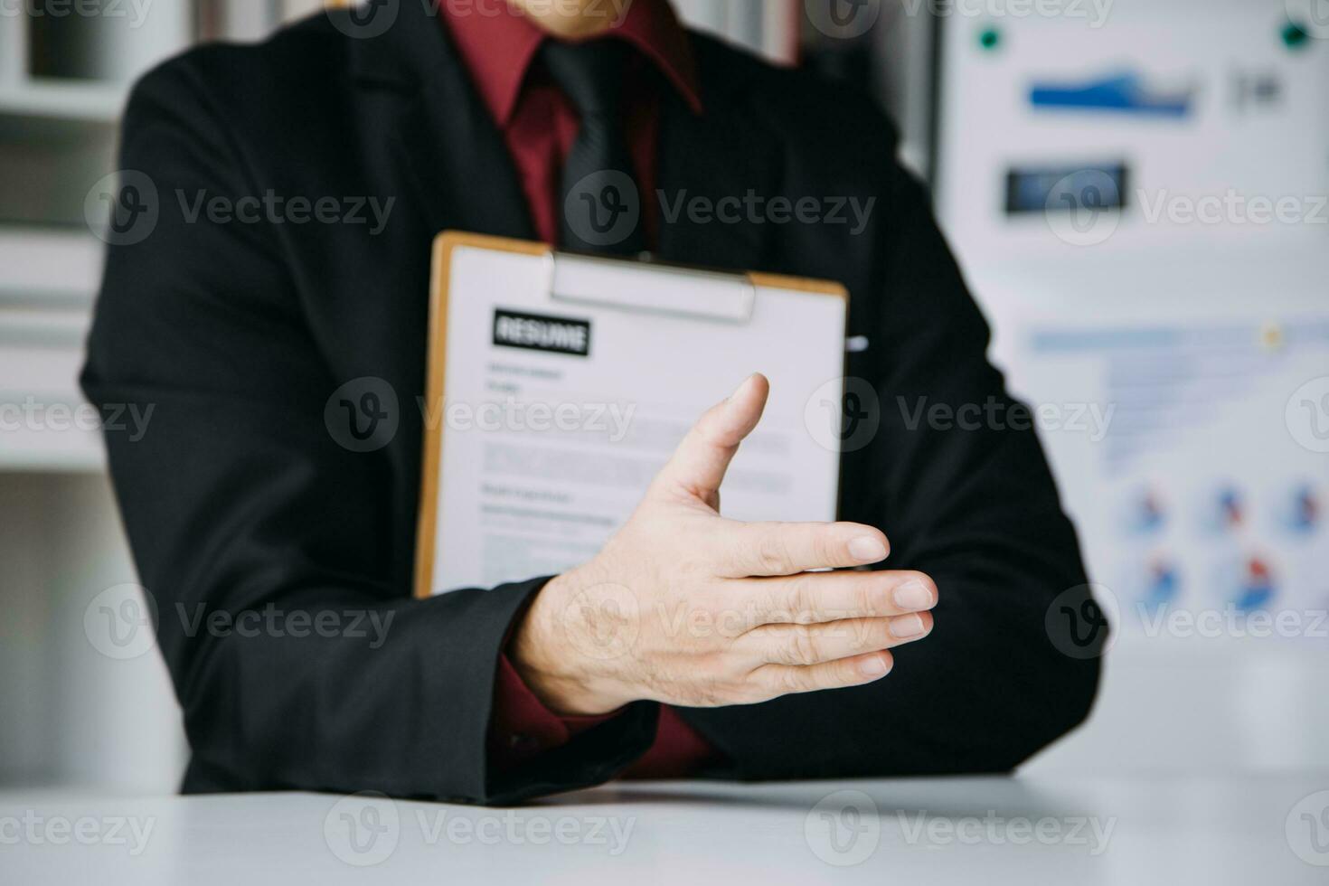 Close up view of job interview in office, focus on resume writing tips, employer reviewing good cv of prepared skilled applicant, recruiter considering application, hr manager making hiring decision photo