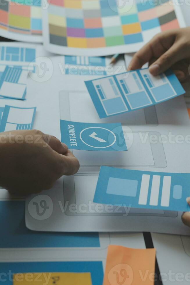 ux Graphic designer creative sketch planning application process development prototype wireframe for web mobile phone . User experience concept. photo