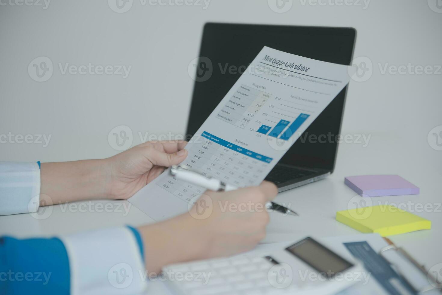 Financial analysts analyze business financial reports on a digital tablet planning investment project during a discussion at a meeting of corporate showing the results of their successful teamwork. photo