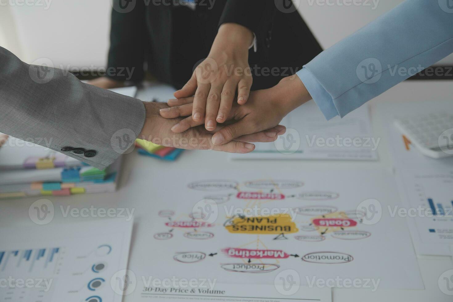 Financial analysts analyze business financial reports on a digital tablet planning investment project during a discussion at a meeting of corporate showing the results of their successful teamwork. photo