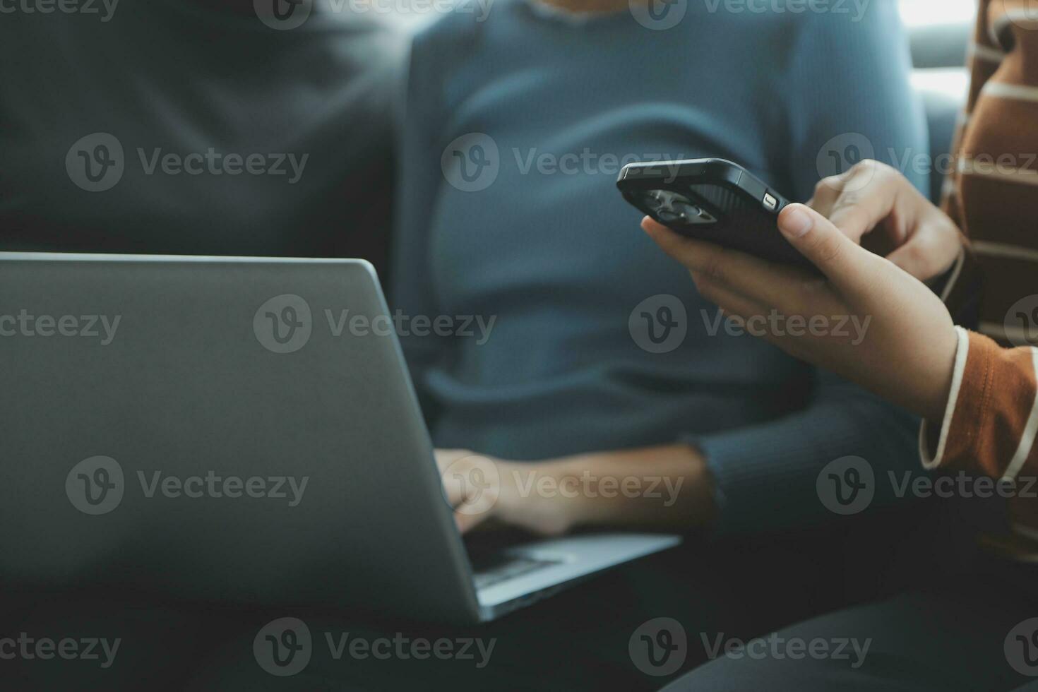 Asian Business woman using calculator and laptop for doing math finance on an office desk, tax, report, accounting, statistics, and analytical research concept photo