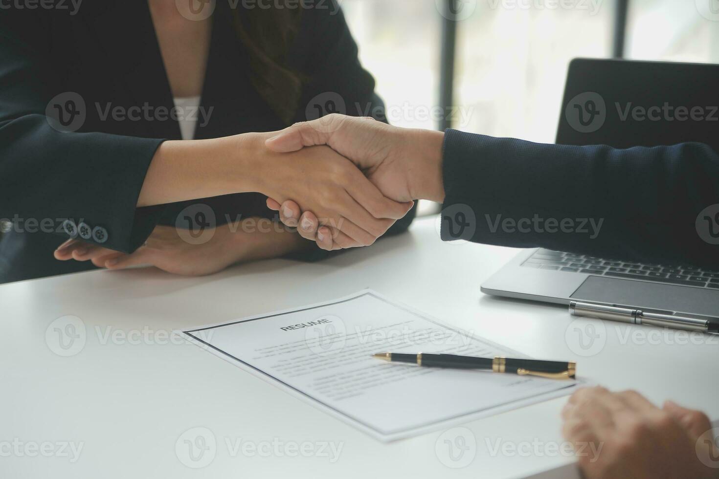 Close up view of job interview in office, focus on resume writing tips, employer reviewing good cv of prepared skilled applicant, recruiter considering application, hr manager making hiring decision photo