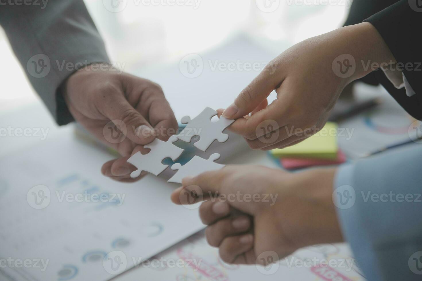 Financial analysts analyze business financial reports on a digital tablet planning investment project during a discussion at a meeting of corporate showing the results of their successful teamwork. photo