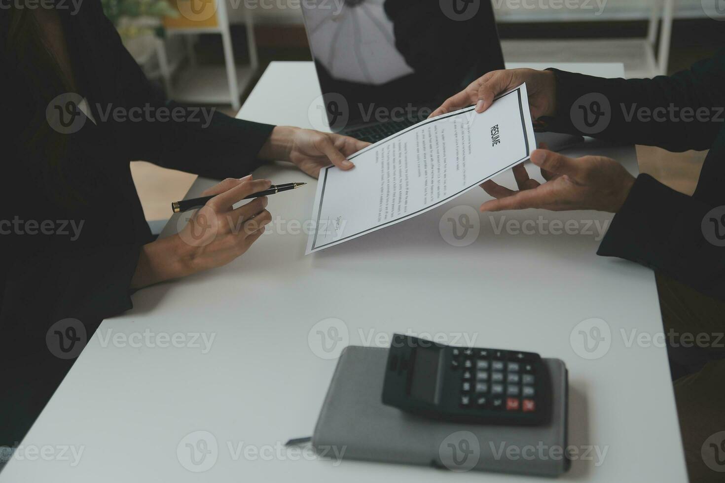 Close up view of job interview in office, focus on resume writing tips, employer reviewing good cv of prepared skilled applicant, recruiter considering application, hr manager making hiring decision photo