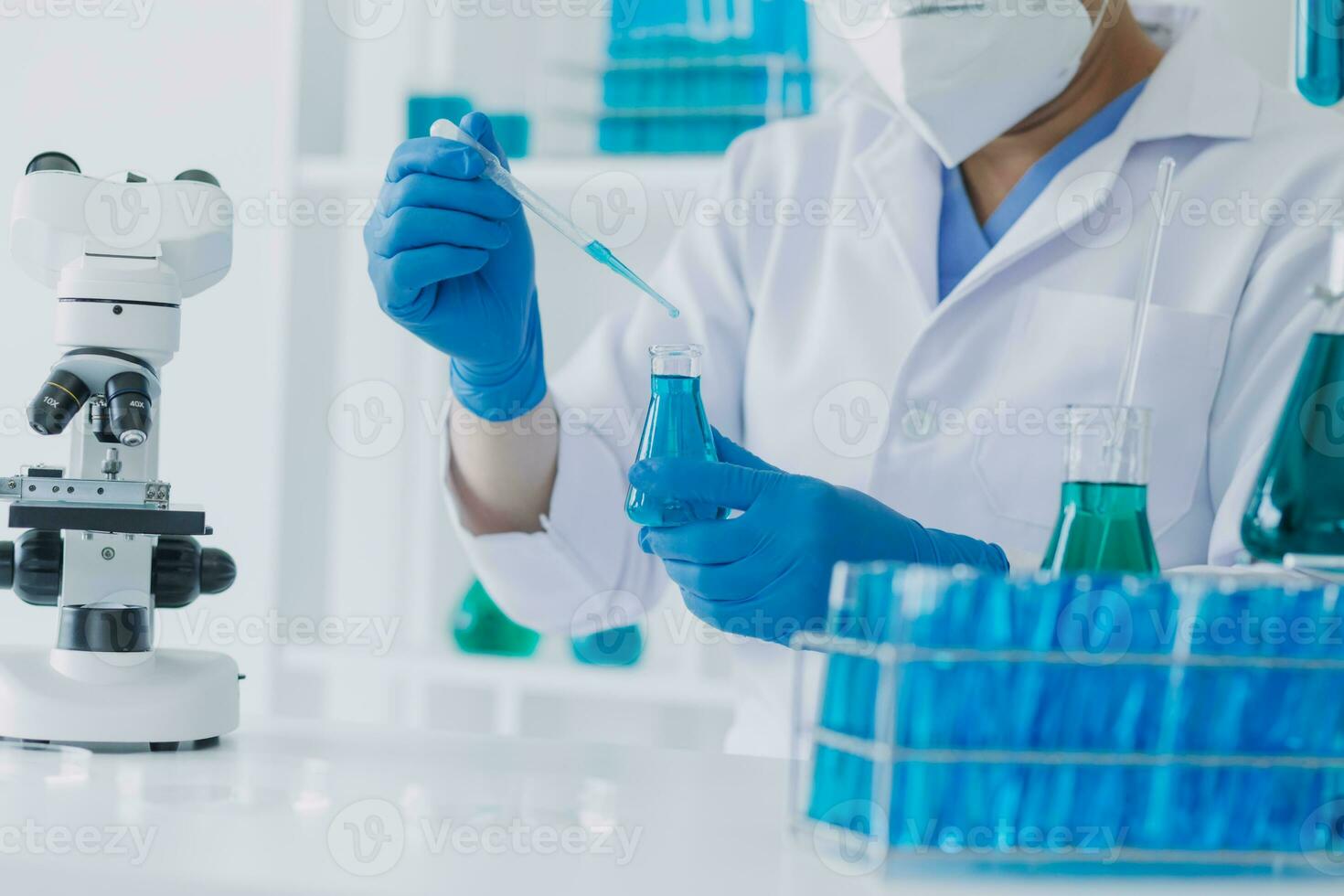 microscope with lab glassware, science laboratory research and development concept photo