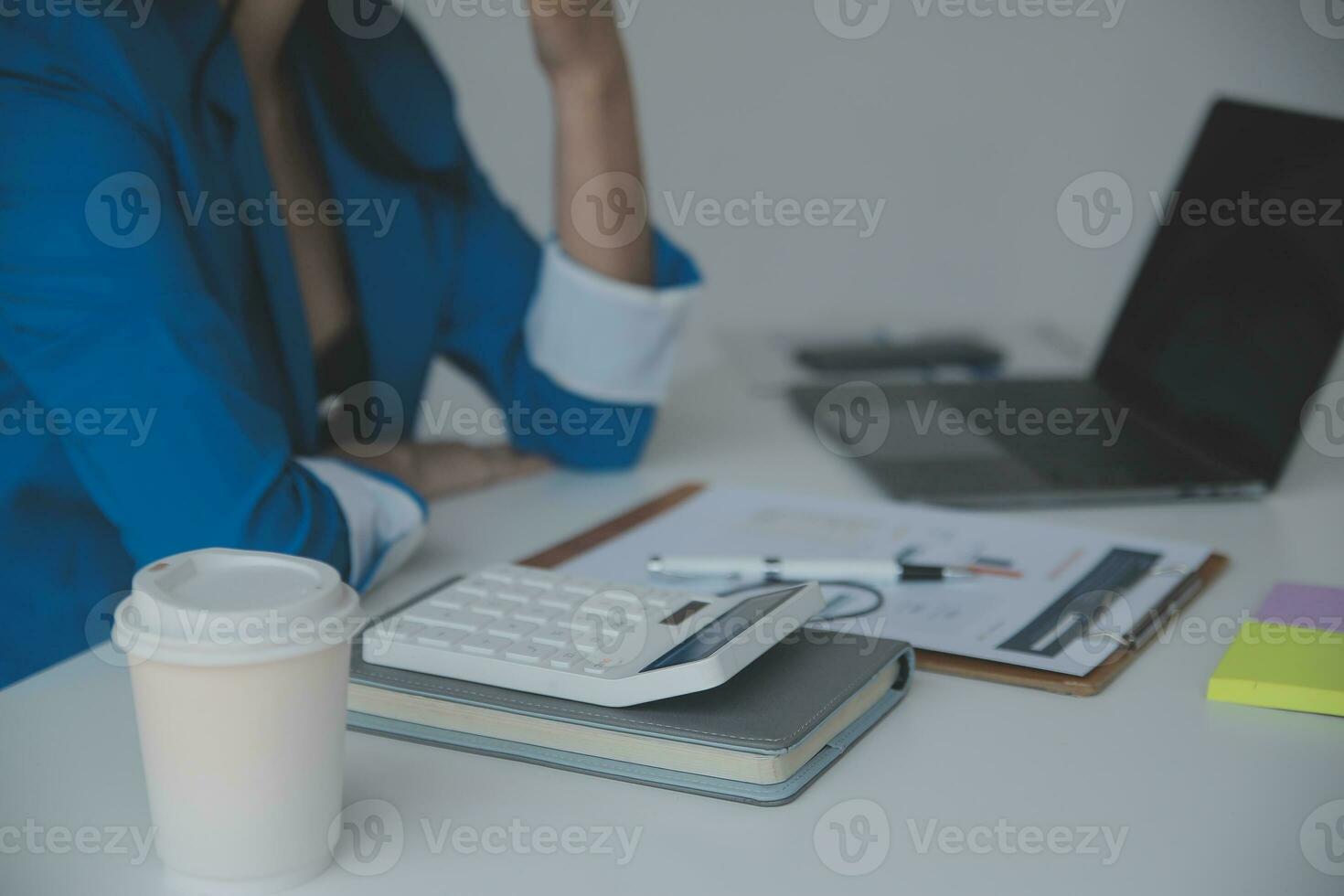Financial analysts analyze business financial reports on a digital tablet planning investment project during a discussion at a meeting of corporate showing the results of their successful teamwork. photo