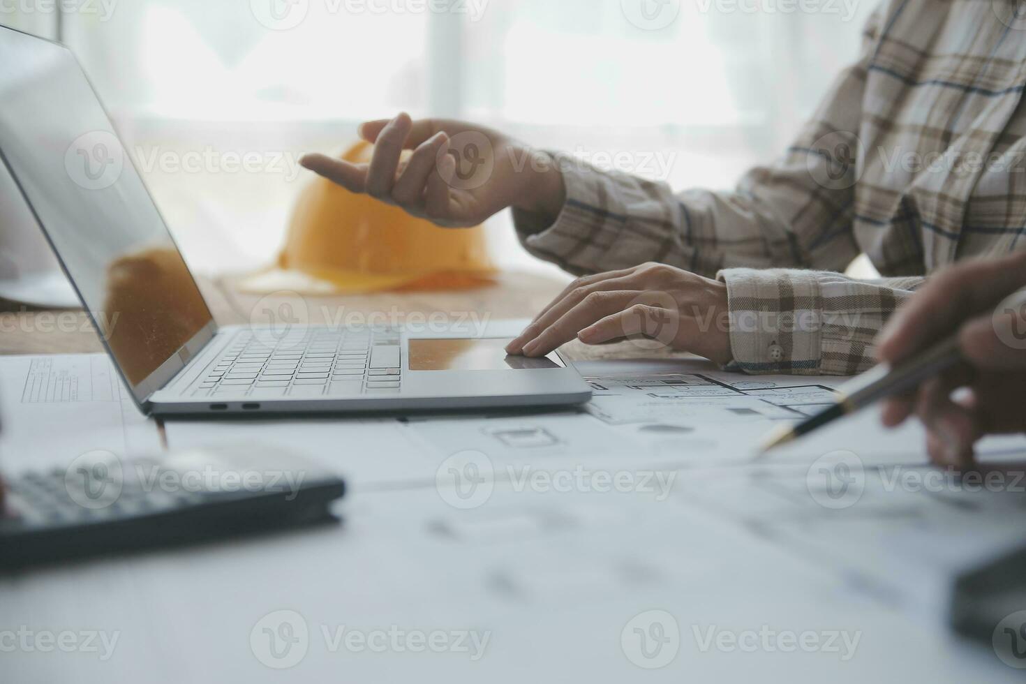 Two business man construction site engineer. Engineering objects on workplace with partners interacting on background photo